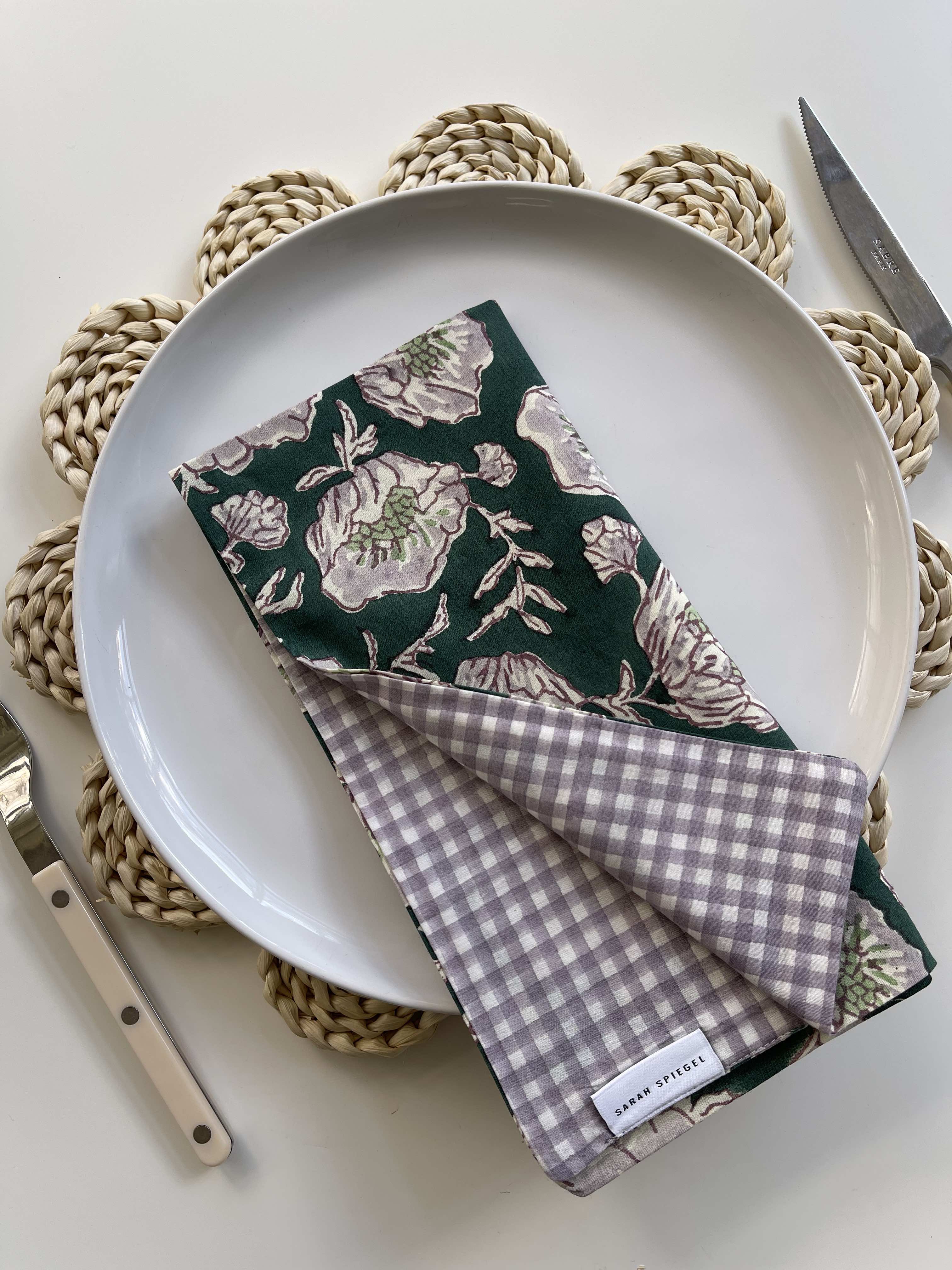 Reversible Floral Napkins folded and displayed showing floral and gingham sides