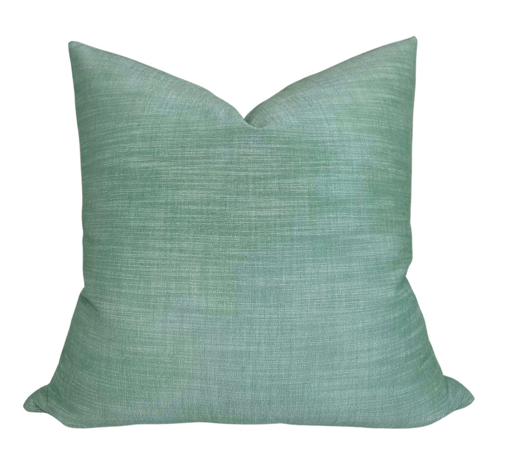 Green woven Maroma Pillow Cover with ivory backing visible