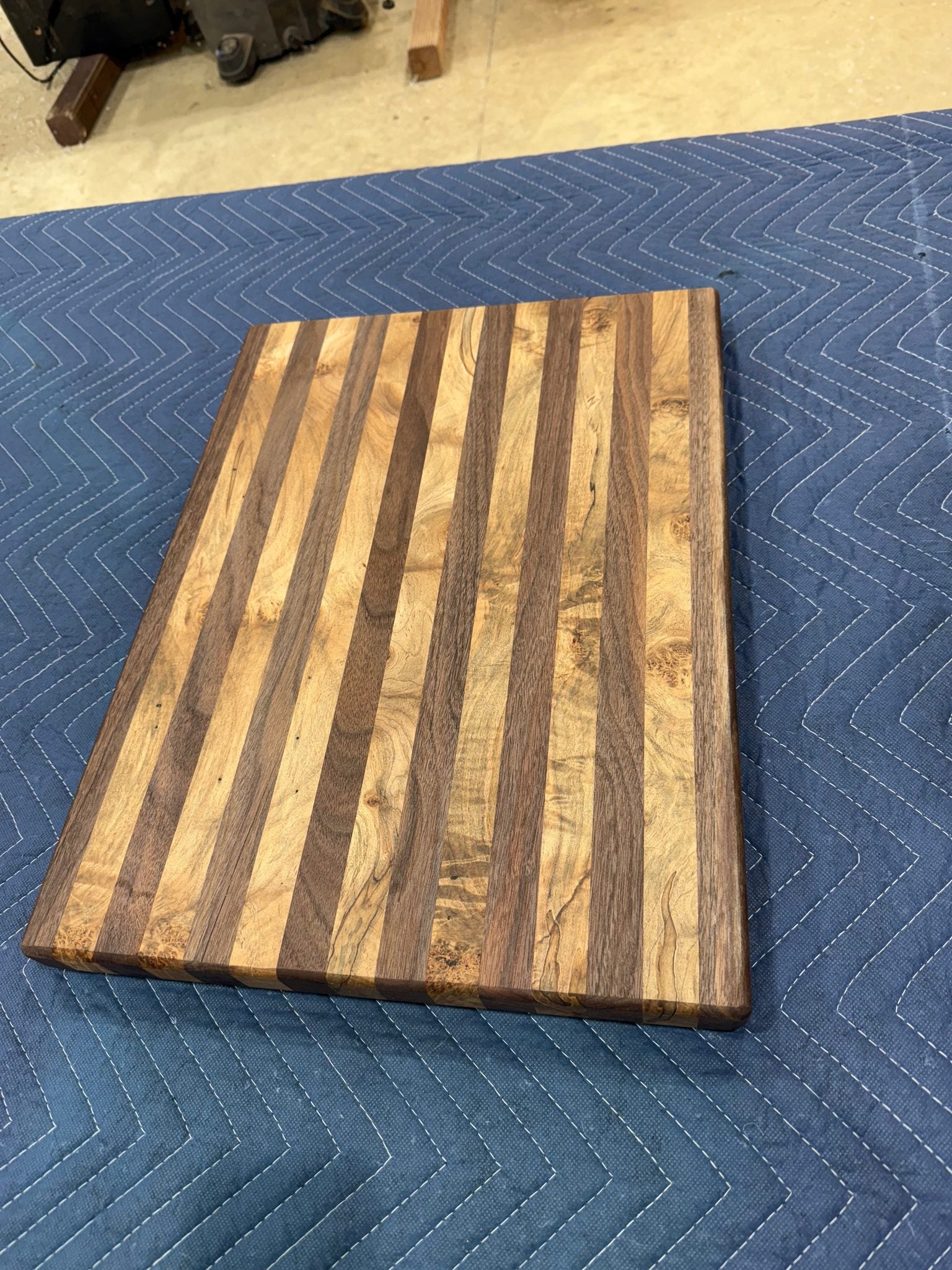 Maple and walnut cutting board with natural wood grain