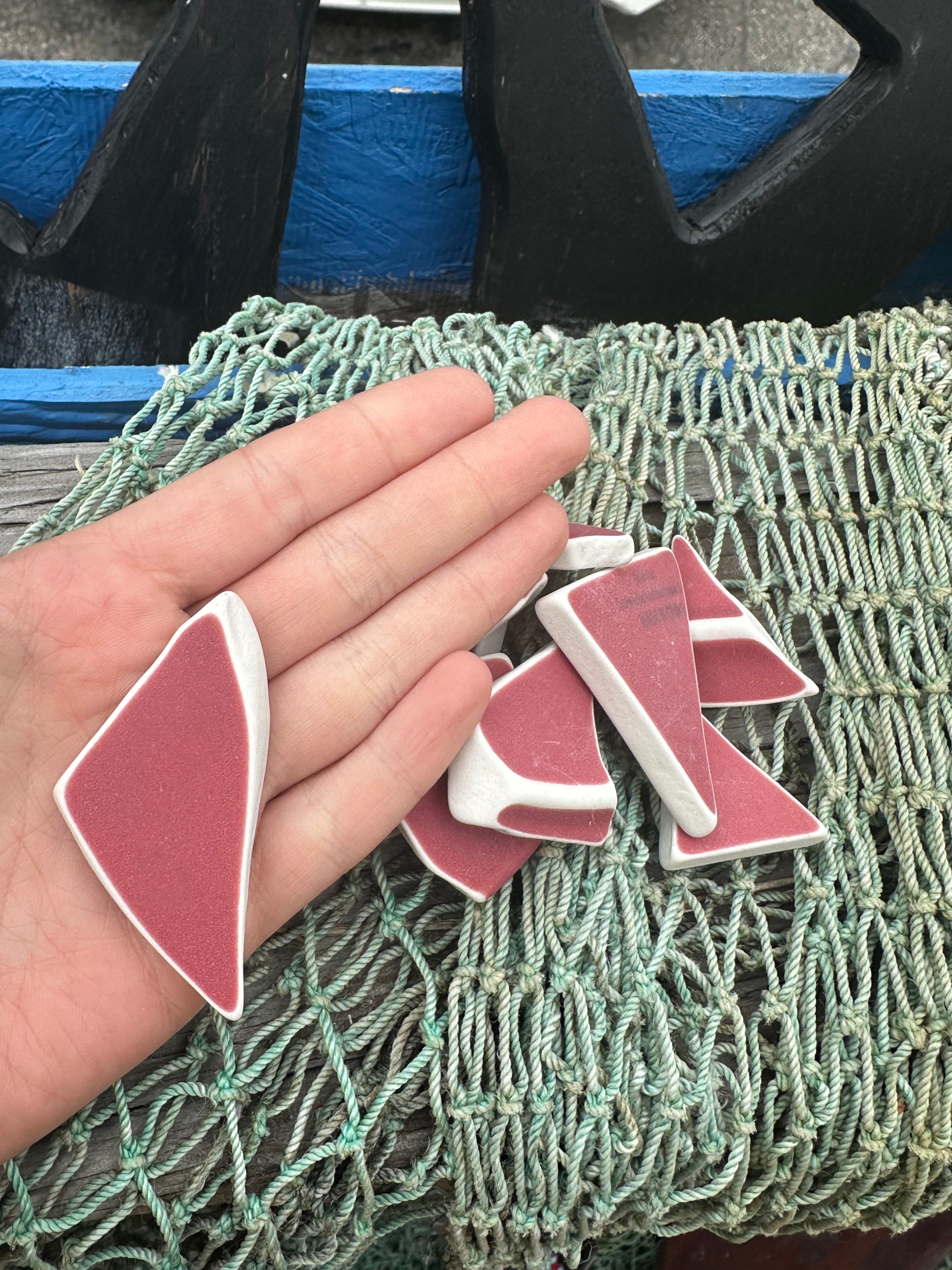 Assorted hand-tumbled pottery pieces in earthy colors for mosaic crafts