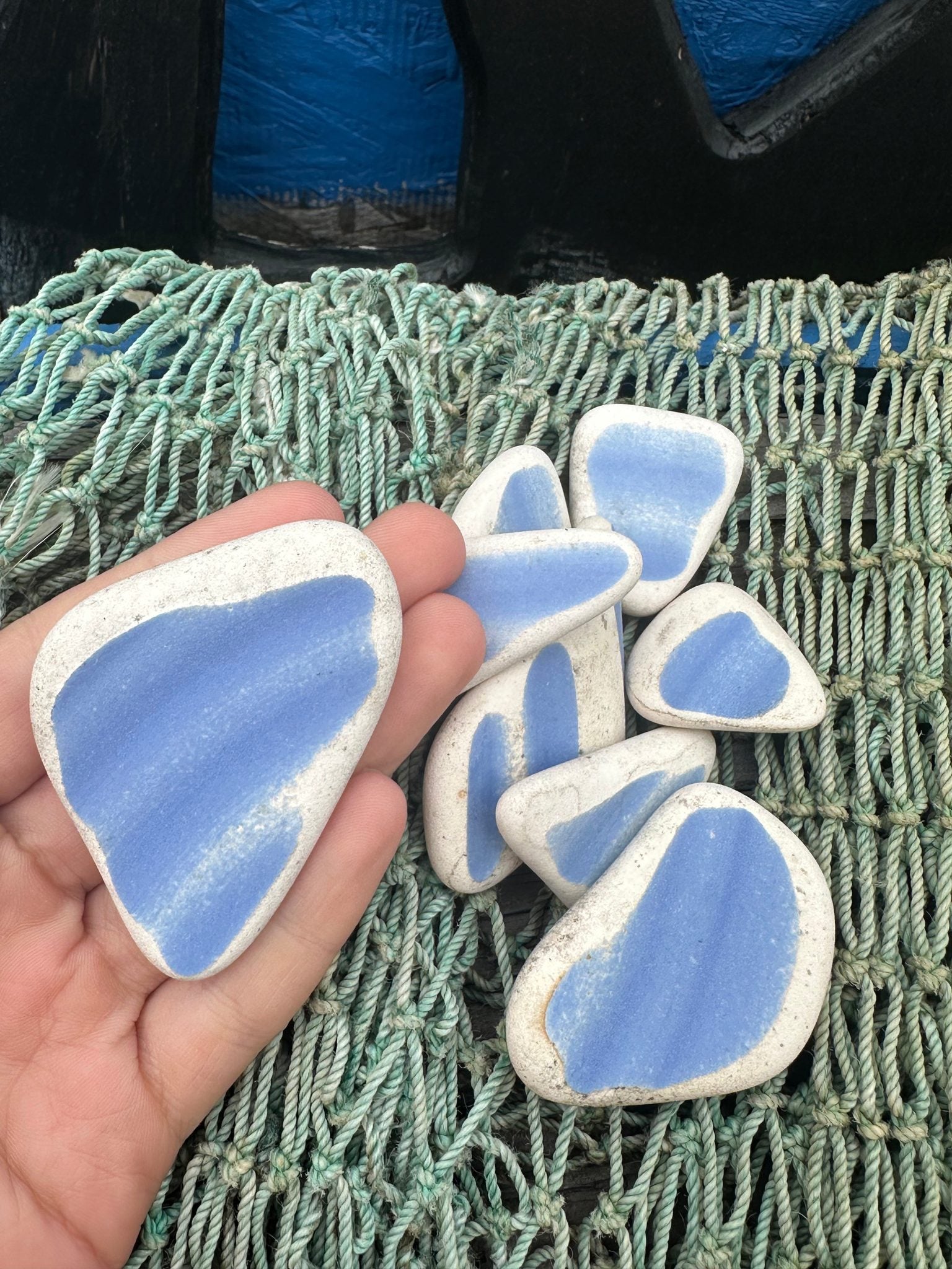 Assorted hand-tumbled pottery pieces in earthy colors for mosaic crafts