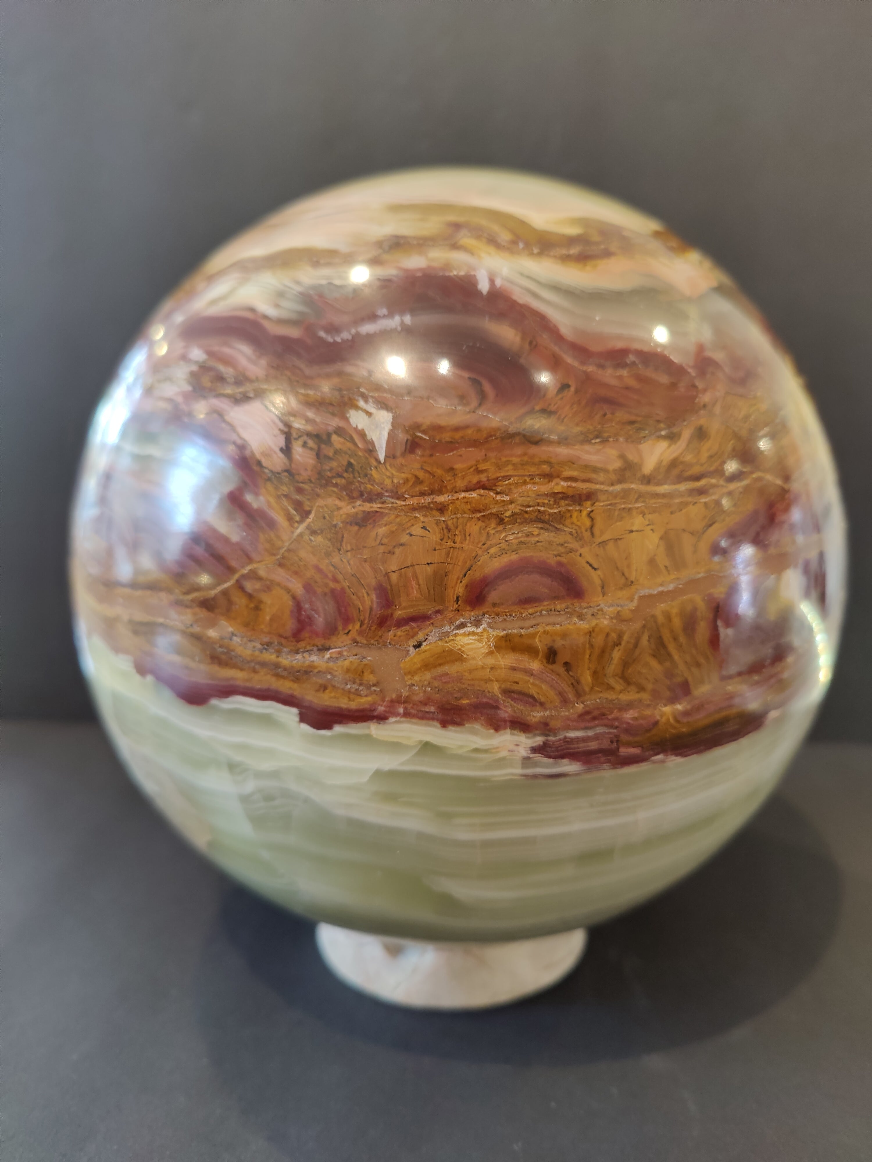 Green Onyx sphere 8 inches diameter displayed on a matching Onyx stand