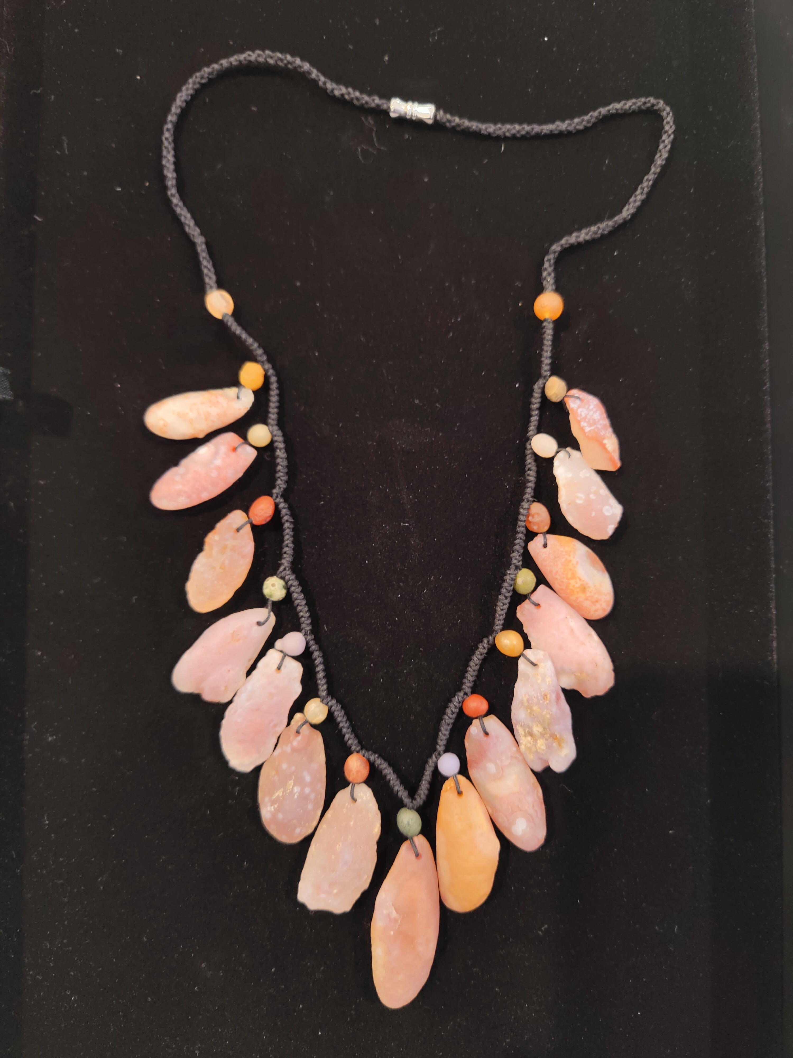 Close-up image of Gobi Desert Candy Agate Cord Necklace on a black cord with clasp