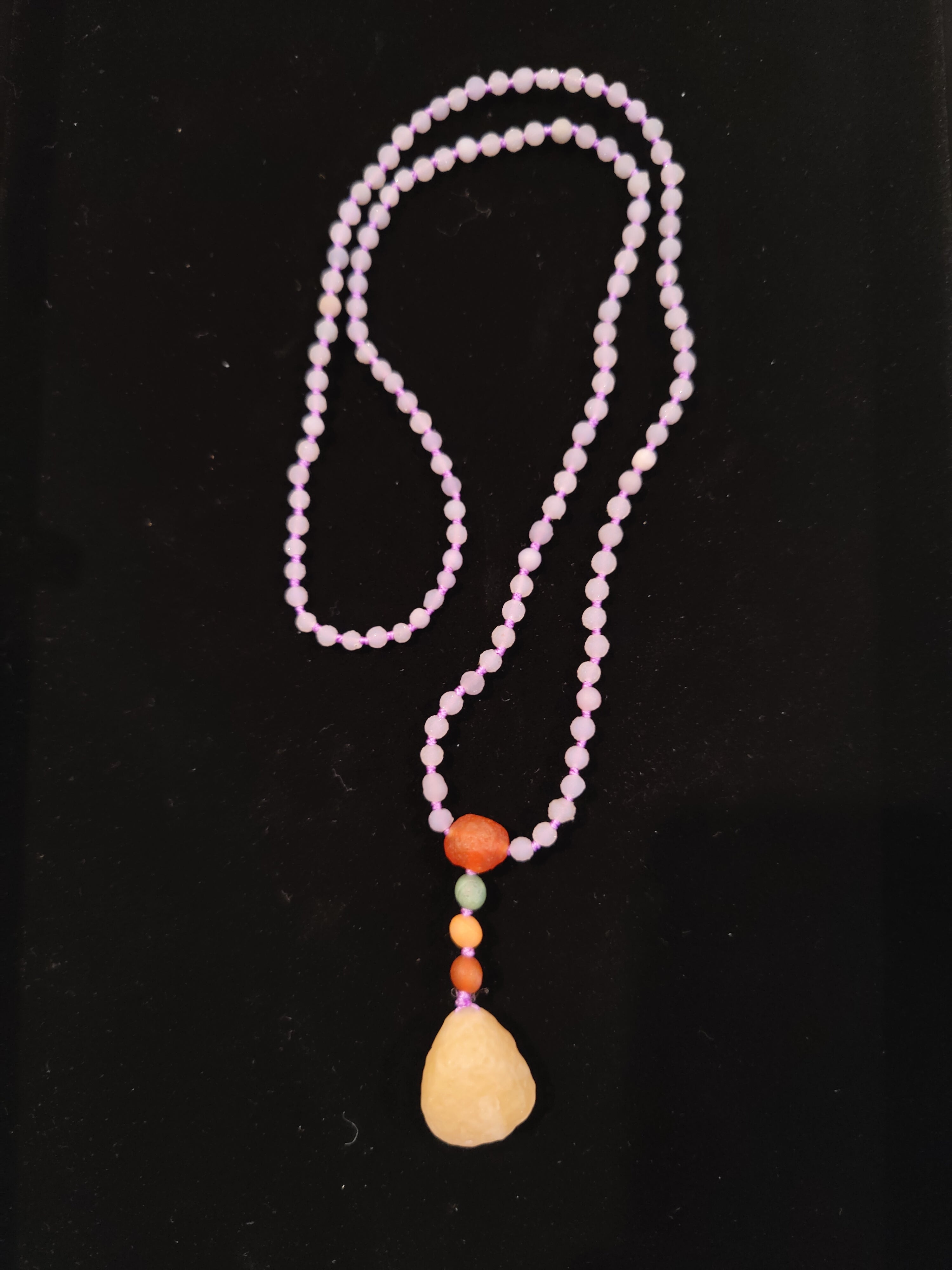 Grape Agate Bead Necklace with Gobi Desert Agate Pendant photographed against a neutral background