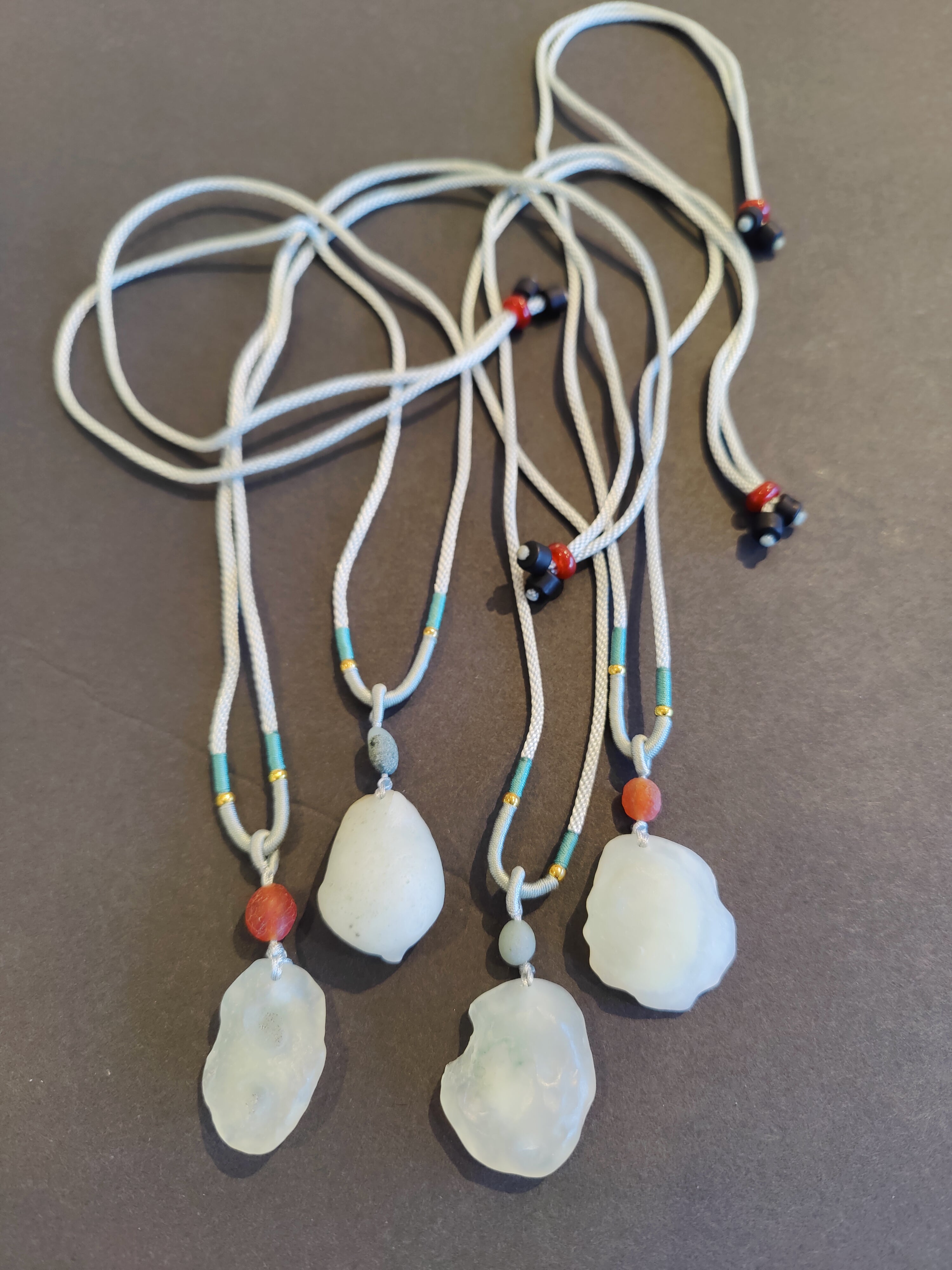 Gobi Desert green moss agate pendant displayed on an adjustable black cord necklace