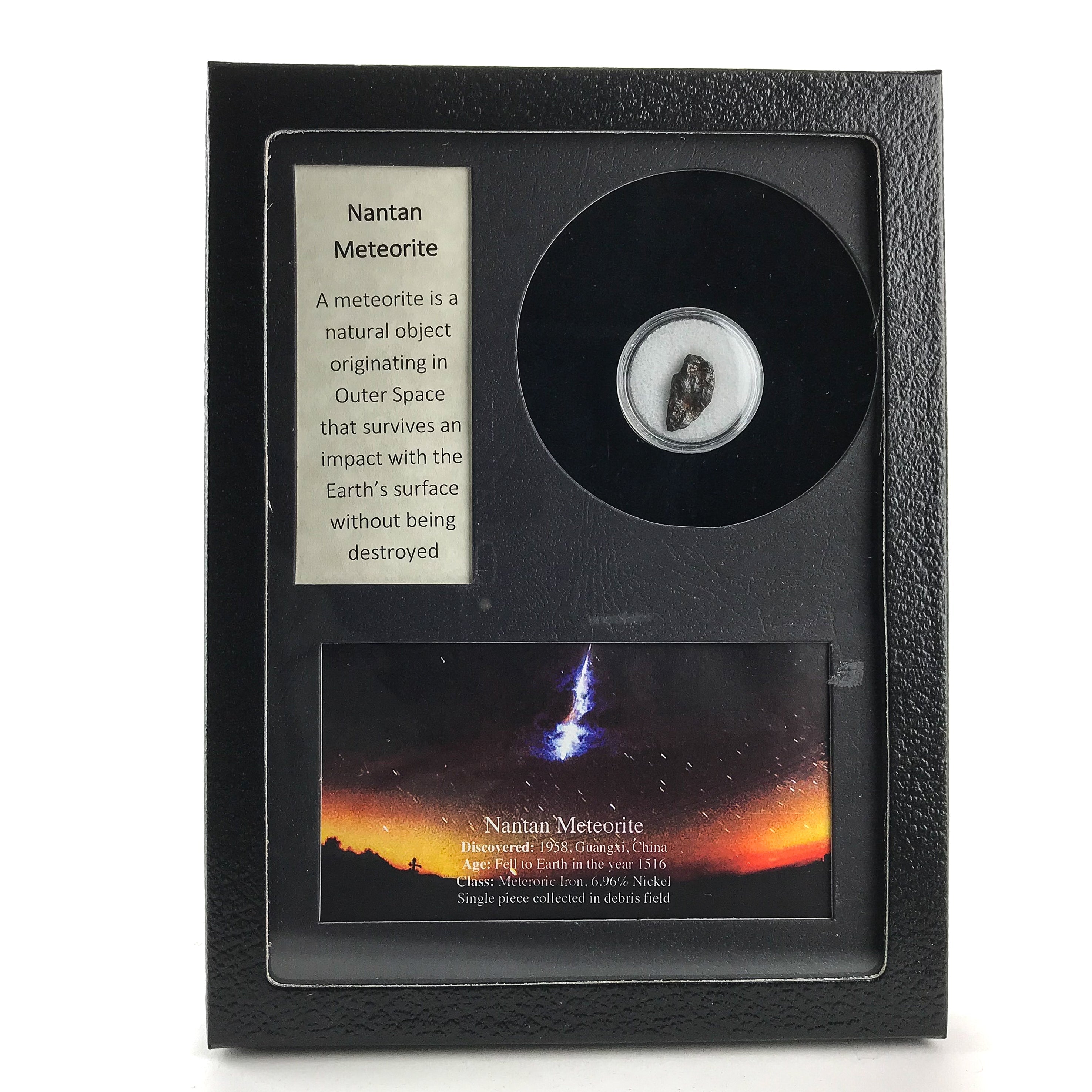 Glass display box containing a fragment of genuine Nantan meteorite with label and color image
