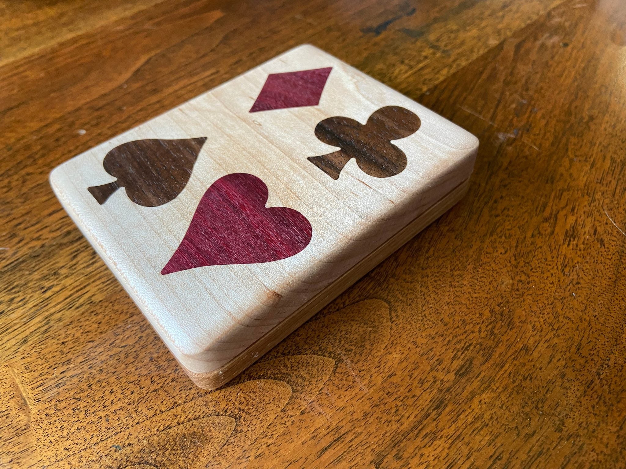 Handcrafted wooden playing card box with wood inlay detail