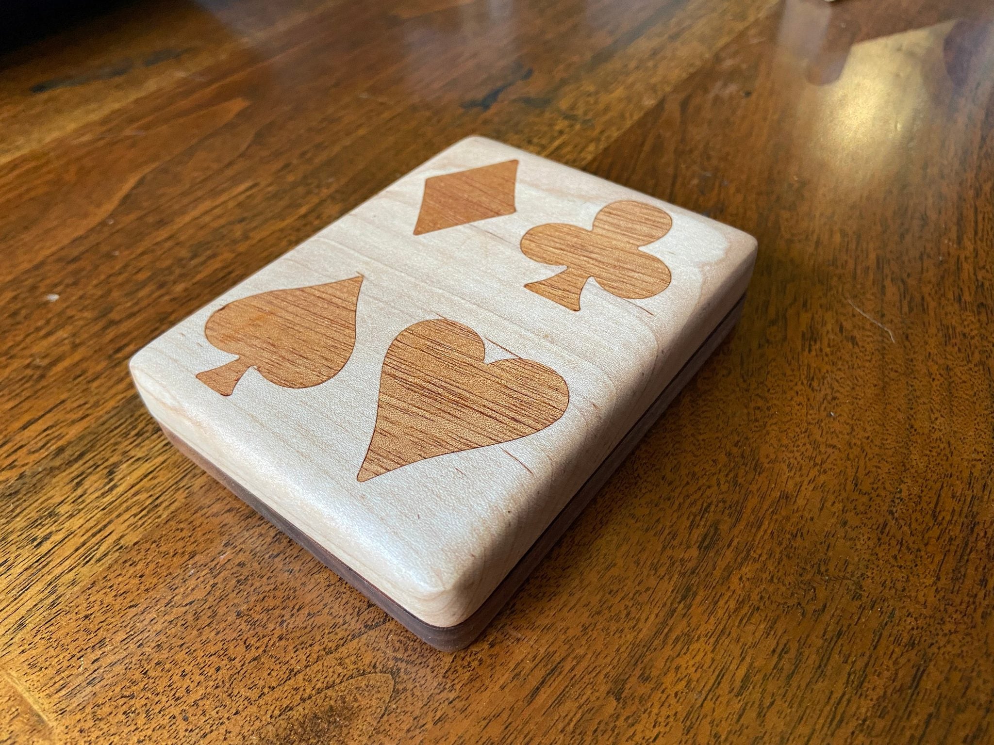 Handcrafted wooden playing card box with wood inlay detail