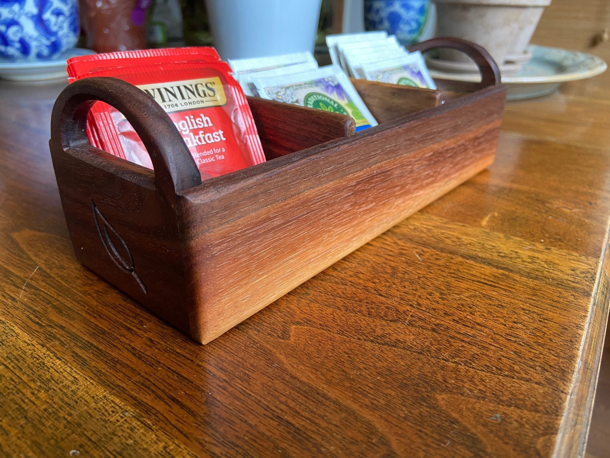 Hand-made walnut tea caddy with custom tea leaf engraving on each end