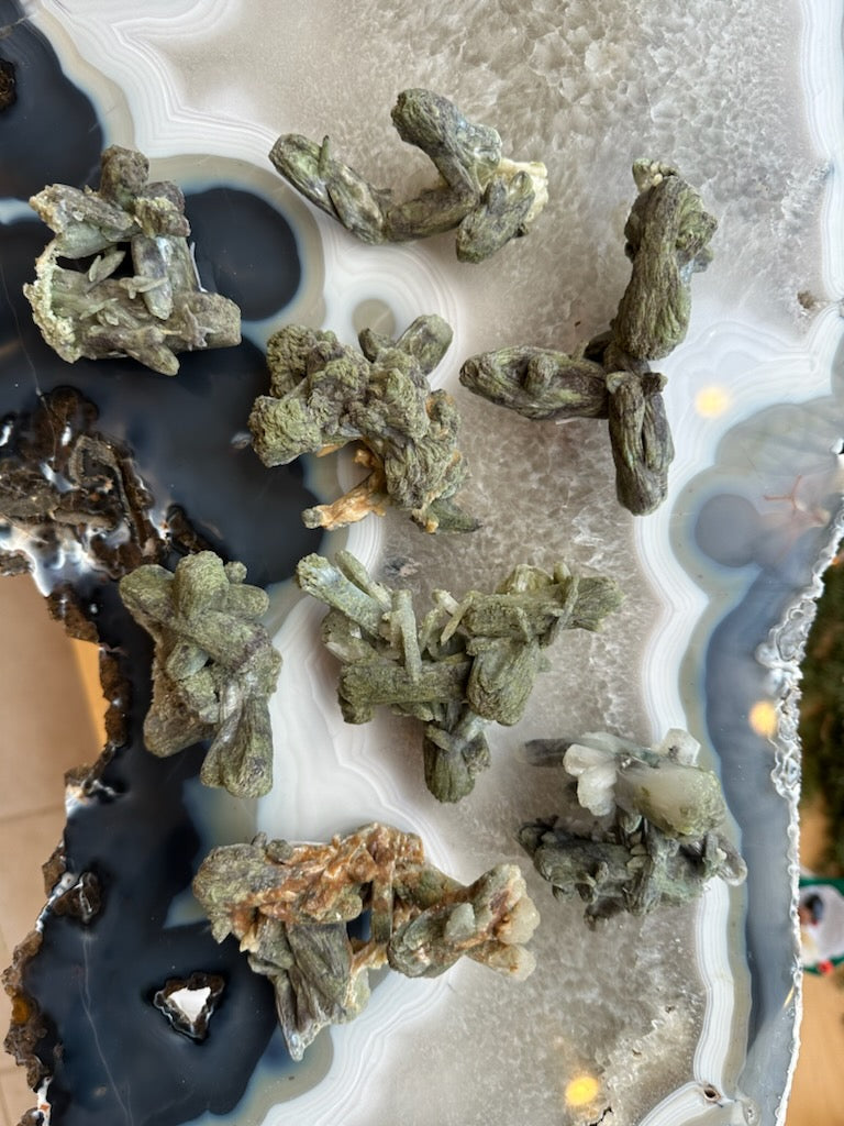 Marshy Stilbite cluster mineral specimen from India with crystal formations, shown on a white background