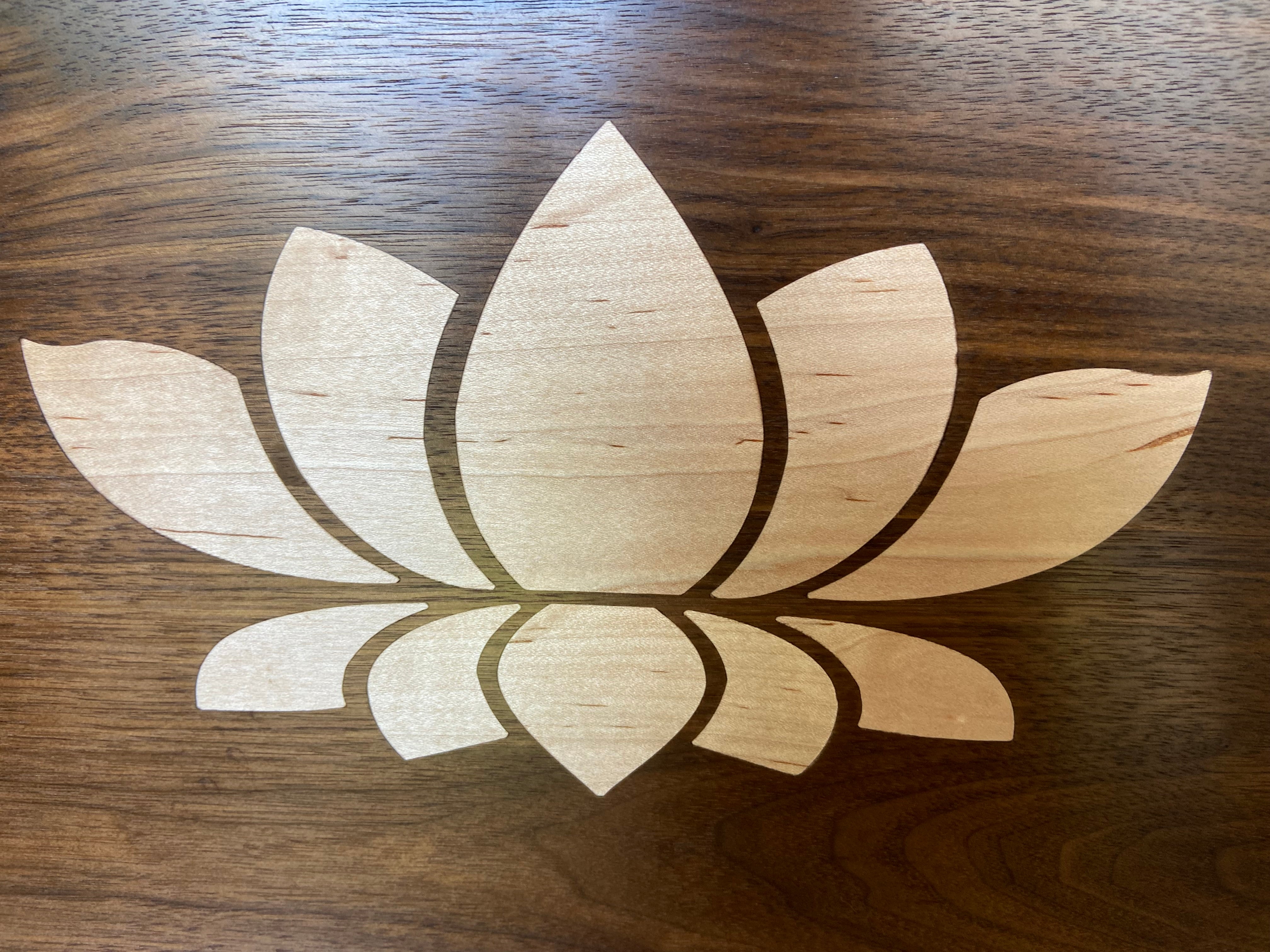 Walnut charcuterie board with lotus flower inlay made from soft maple wood