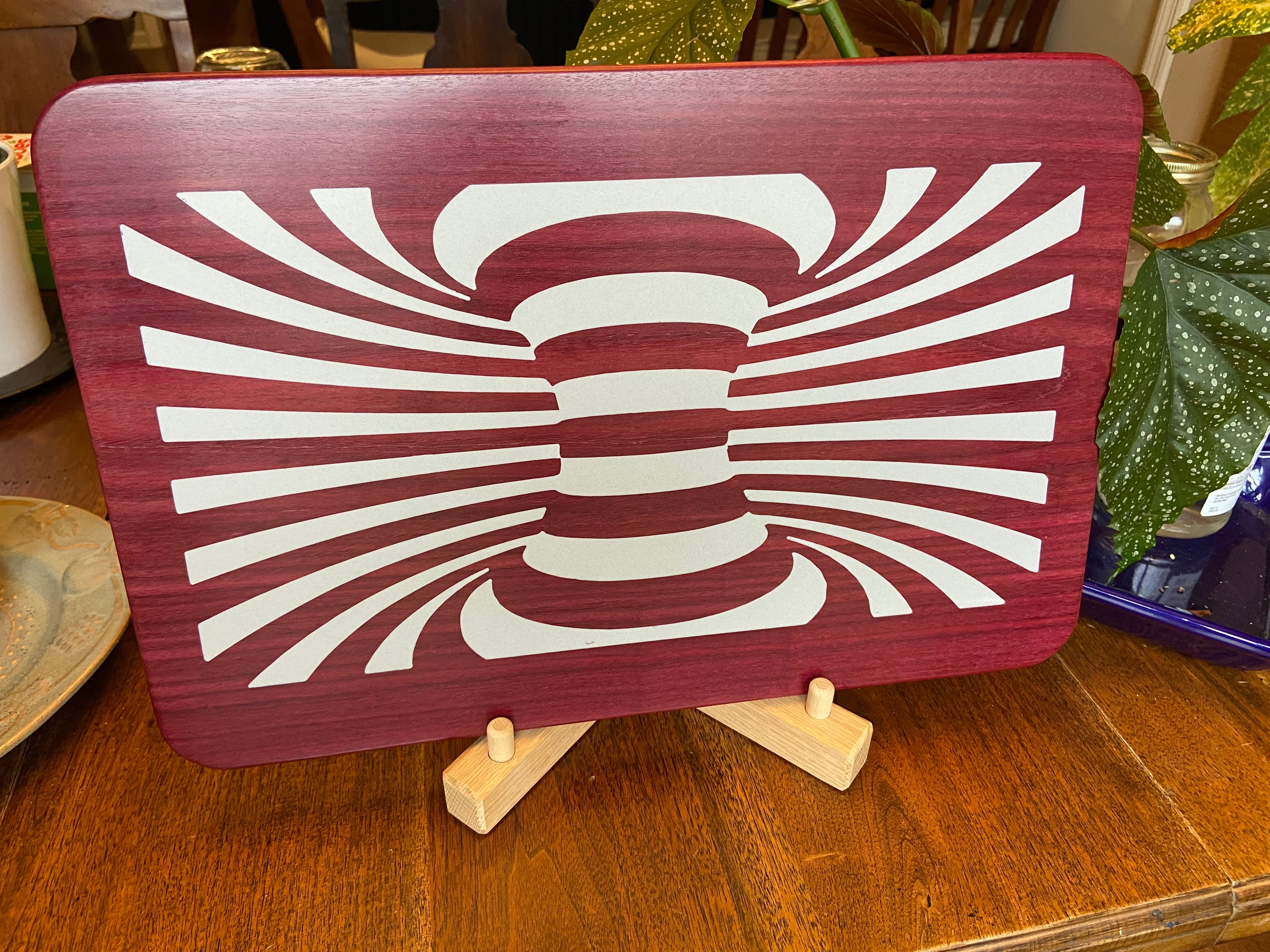 Purple Heart wood charcuterie board with resin worm hole inlay handcrafted by Fitzgerald Custom Woodcraft
