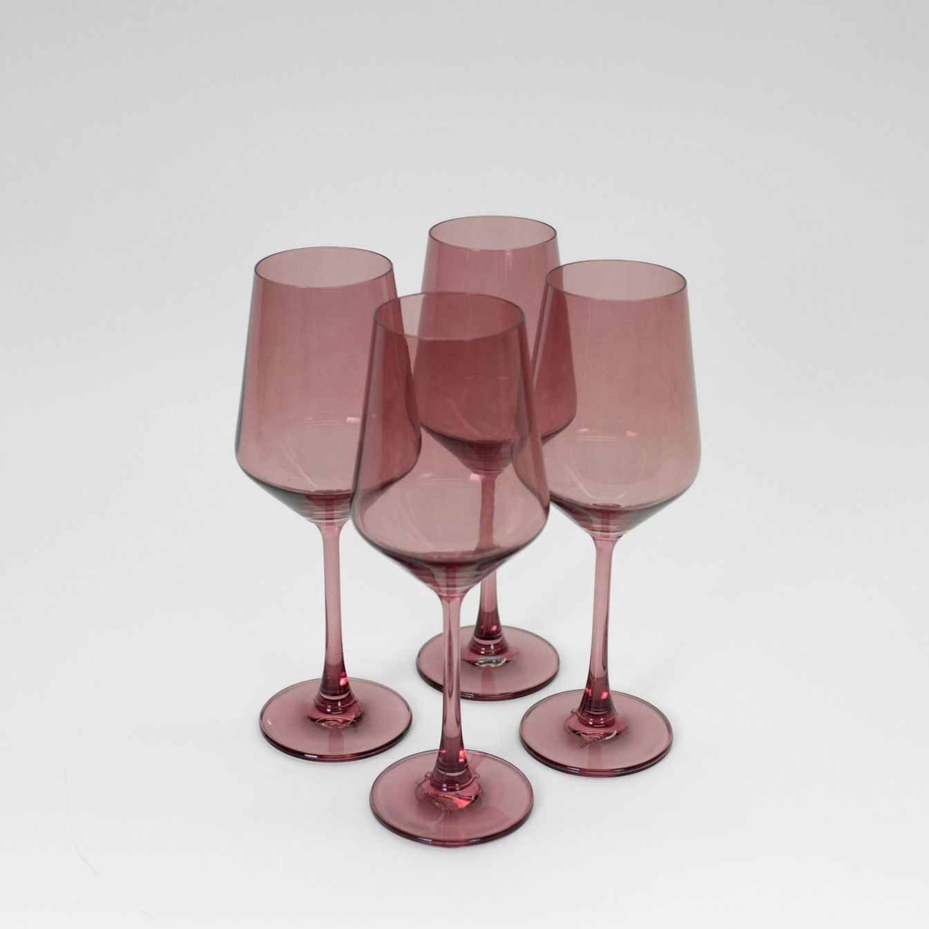 Mauvelous Colored Wine Glass with soft mauve hue on a neutral background