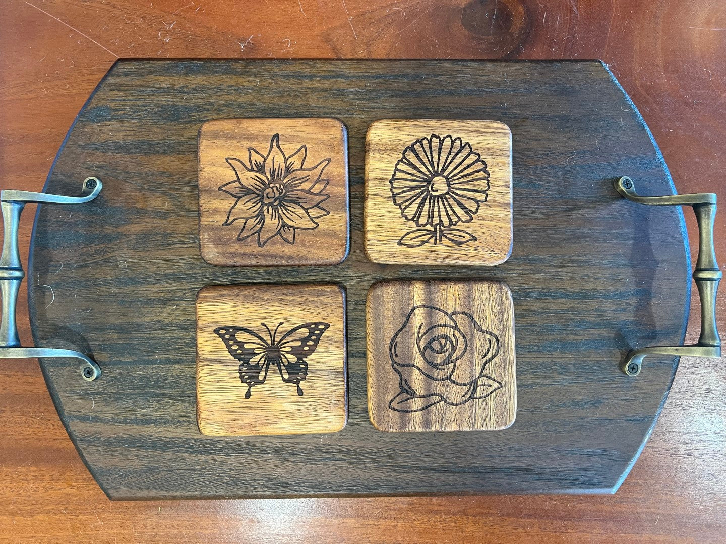 Set of four East Indian Walnut coasters with custom engraved designs including photo and monogram examples.