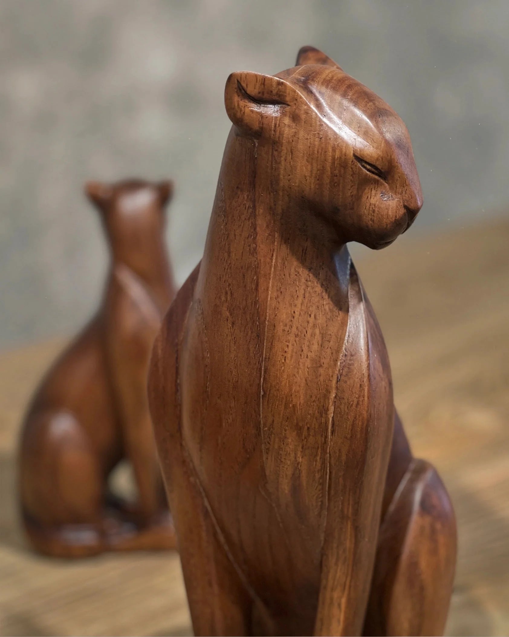 Handcrafted wooden wild cat figure in natural wood finish