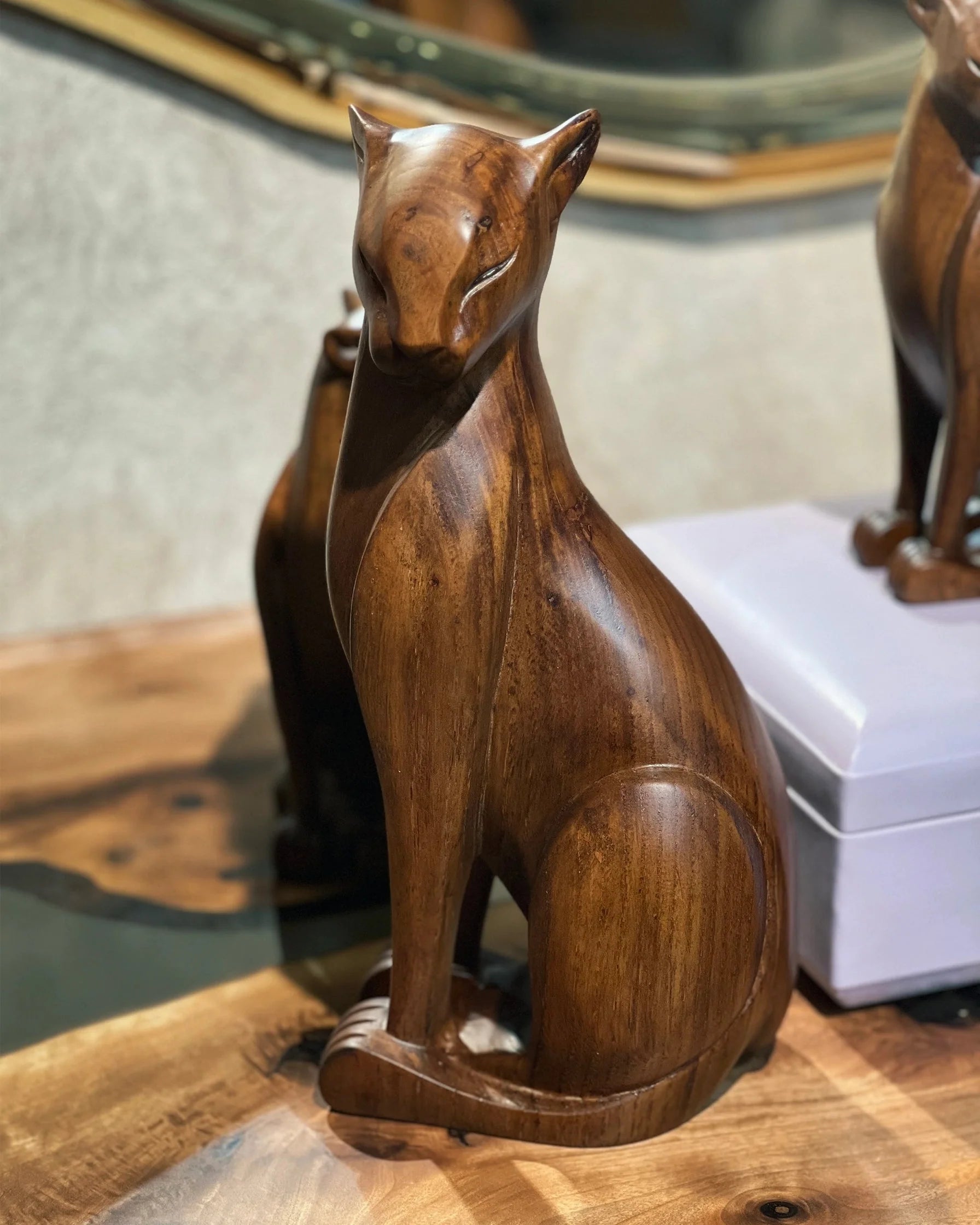 Handcrafted wooden wild cat figure in natural wood finish