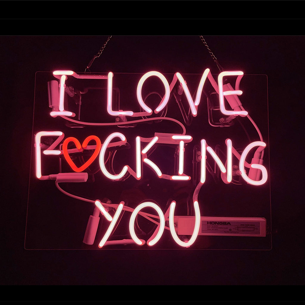 Pink I Love Fucking You neon sign illuminated on acrylic backing