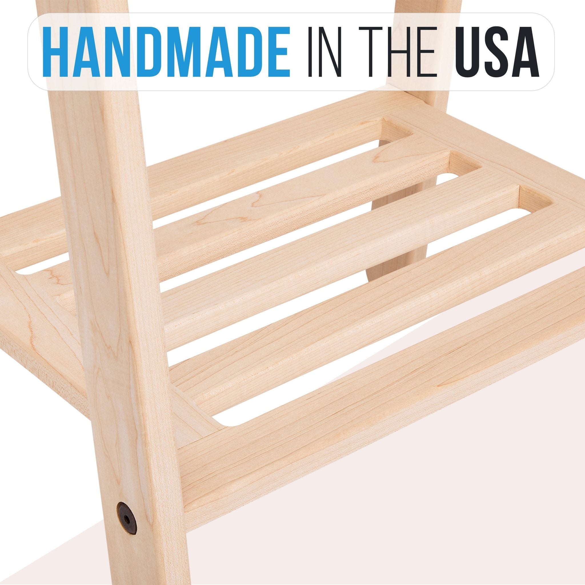 Handcrafted wooden garment rack holding clothes and coats in a home setting