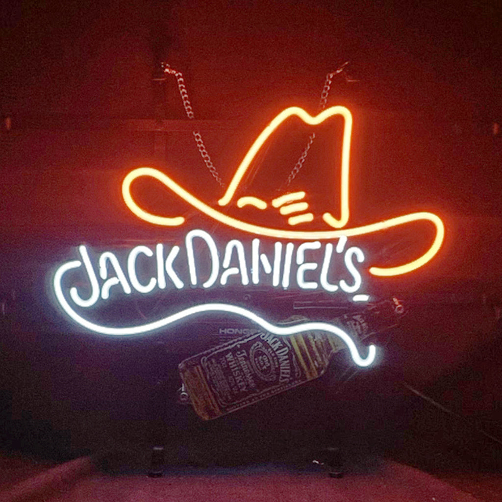 Jack Daniel's Bottle Neon Sign hanging on wall illuminated in amber glow