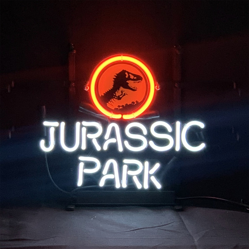 Jurassic Park Dino Neon Sign glowing in vibrant orange on metal grid backing
