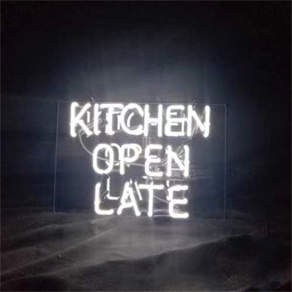 Kitchen Open Late Neon Sign glowing against a dark wall
