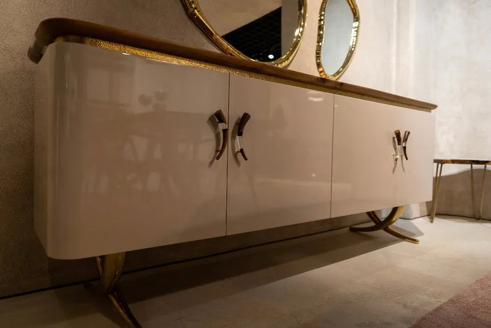 Modern resin and walnut credenza with aluminum legs in a stylish living room setting