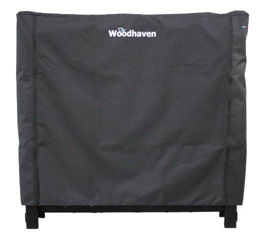 Woodhaven Full Firewood Rack Cover with zipper closure protecting stacked firewood outdoors