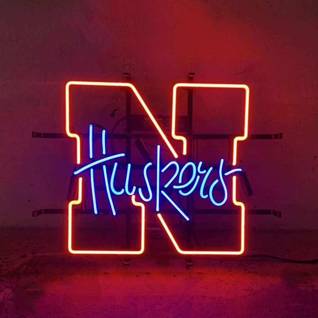University of Nebraska Huskers Neon Light Sign glowing in red on metal grid backing