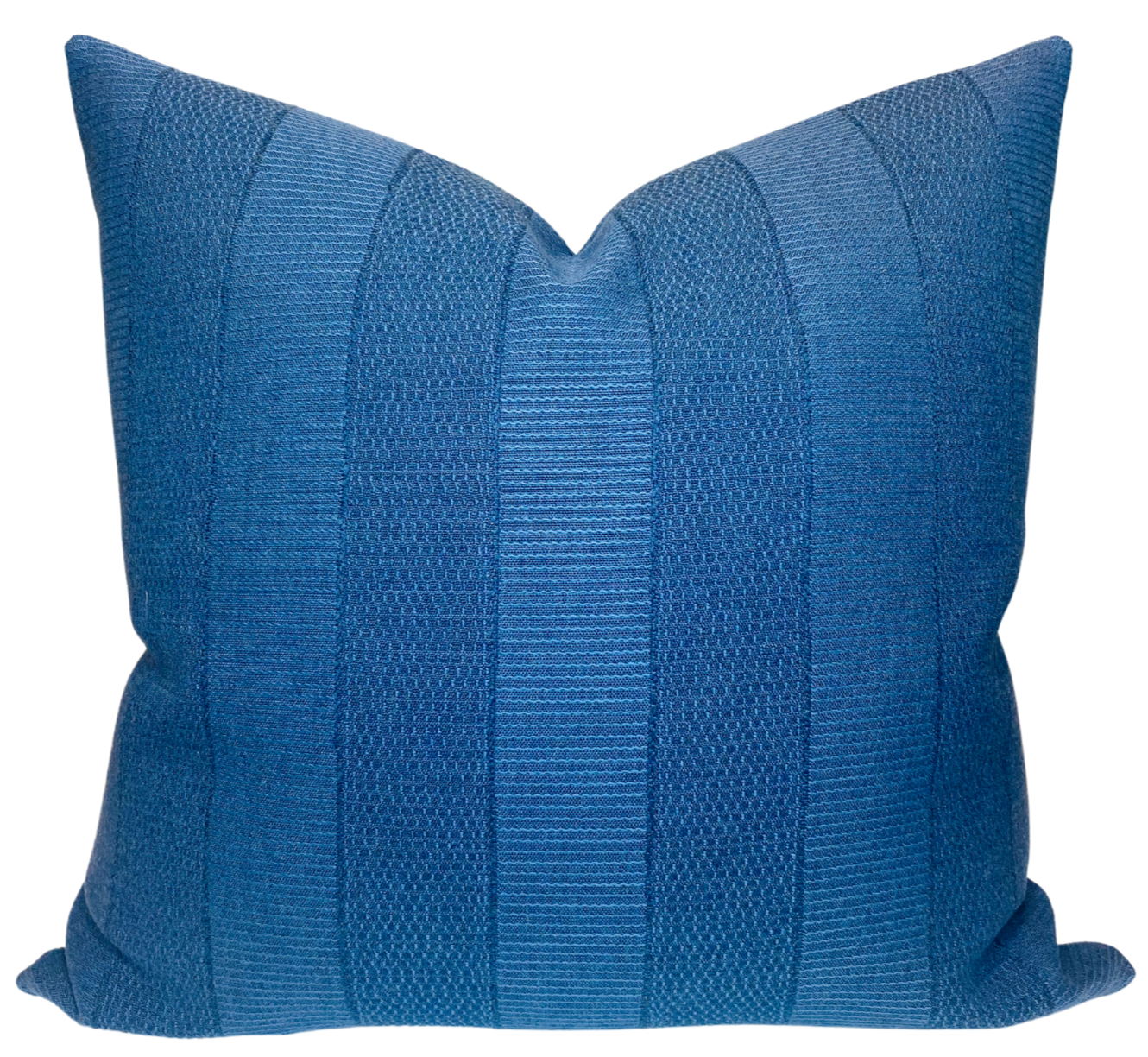 Midnight blue Asilah pillow cover by Peter Dunham Textiles displayed on a neutral sofa