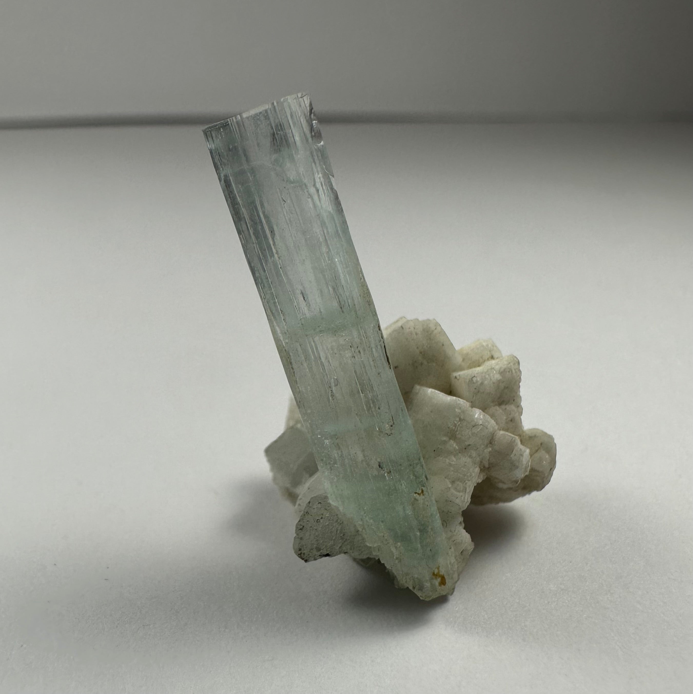 Aquamarine with Albite mineral specimen from Shigar Valley, Skardu, Pakistan displayed on a black background