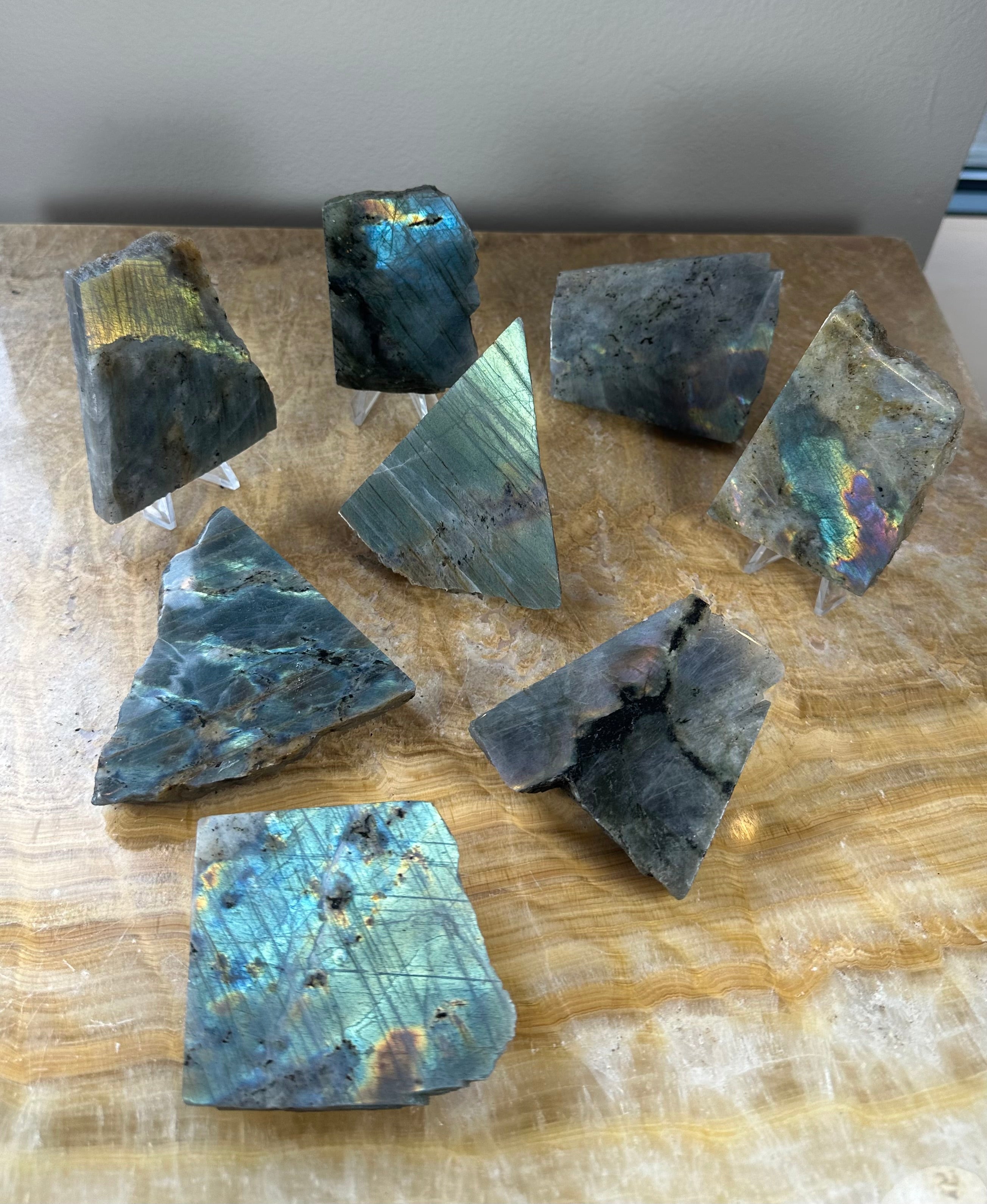 Two polished one-sided Labradorite slabs displaying diverse colors and textures