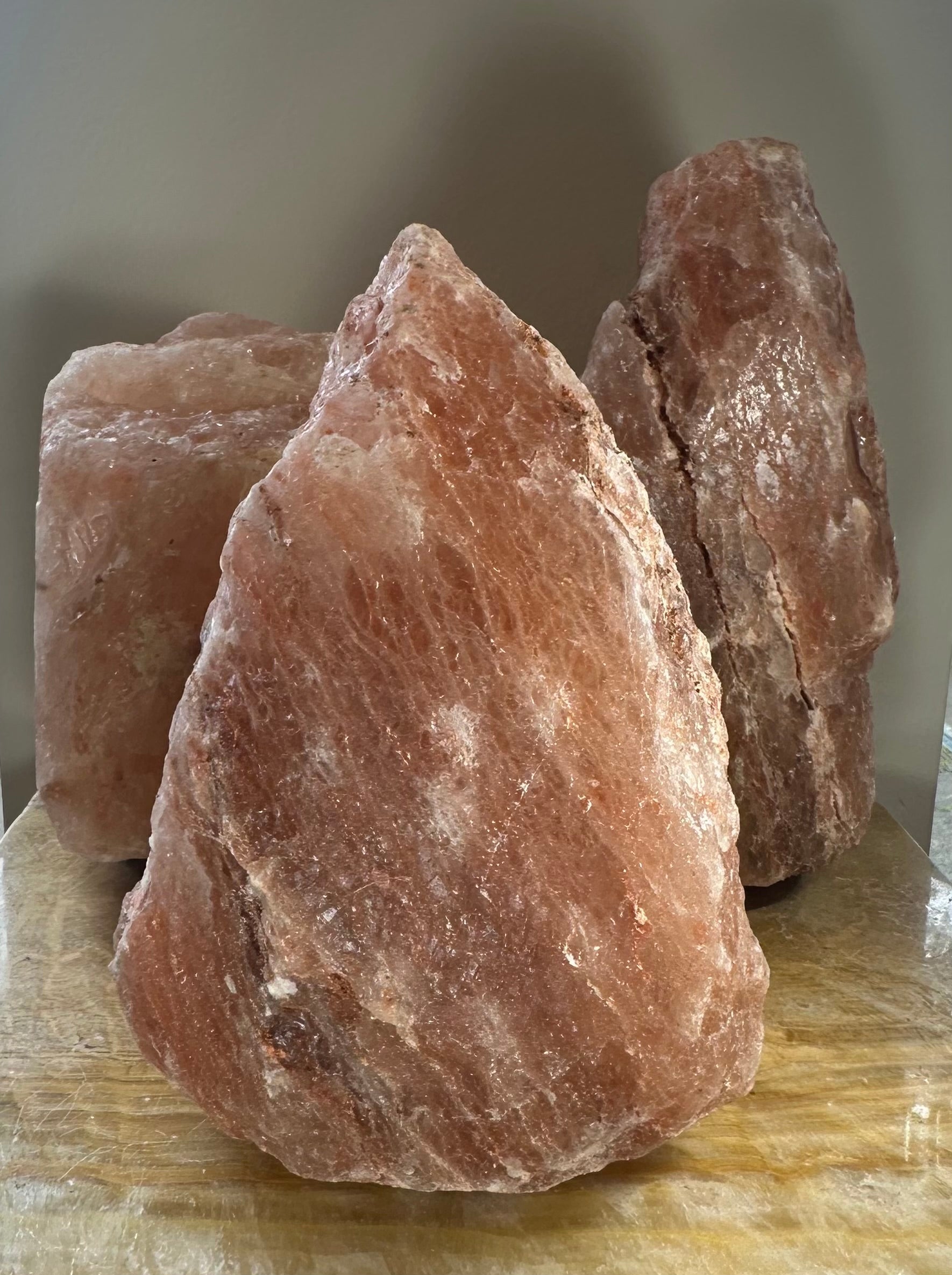 Himalayan Pink Salt Lamp glowing softly on a bedside table