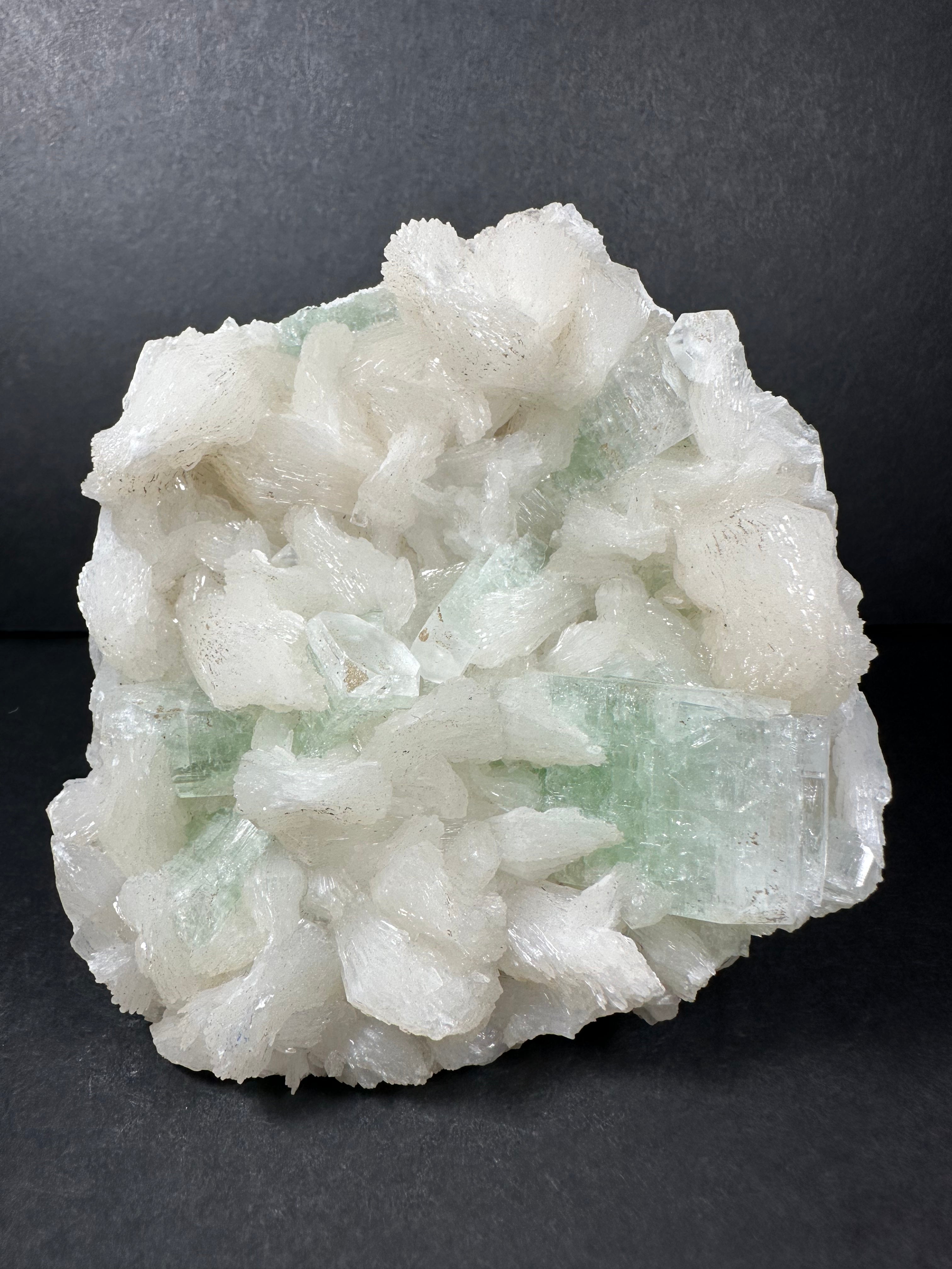 Light Green Apophyllite with Stilbite mineral specimen photographed with pale green and white crystals