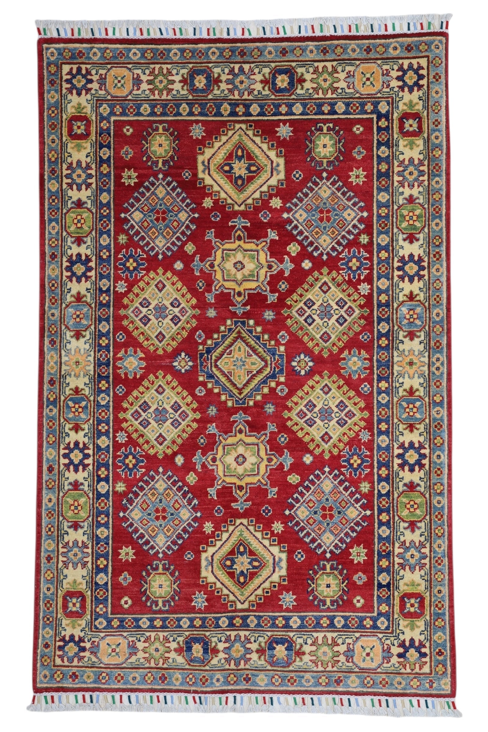 Hand-knotted Afghani Kazak wool rug in red with intricate geometric patterns, laid on wooden floor