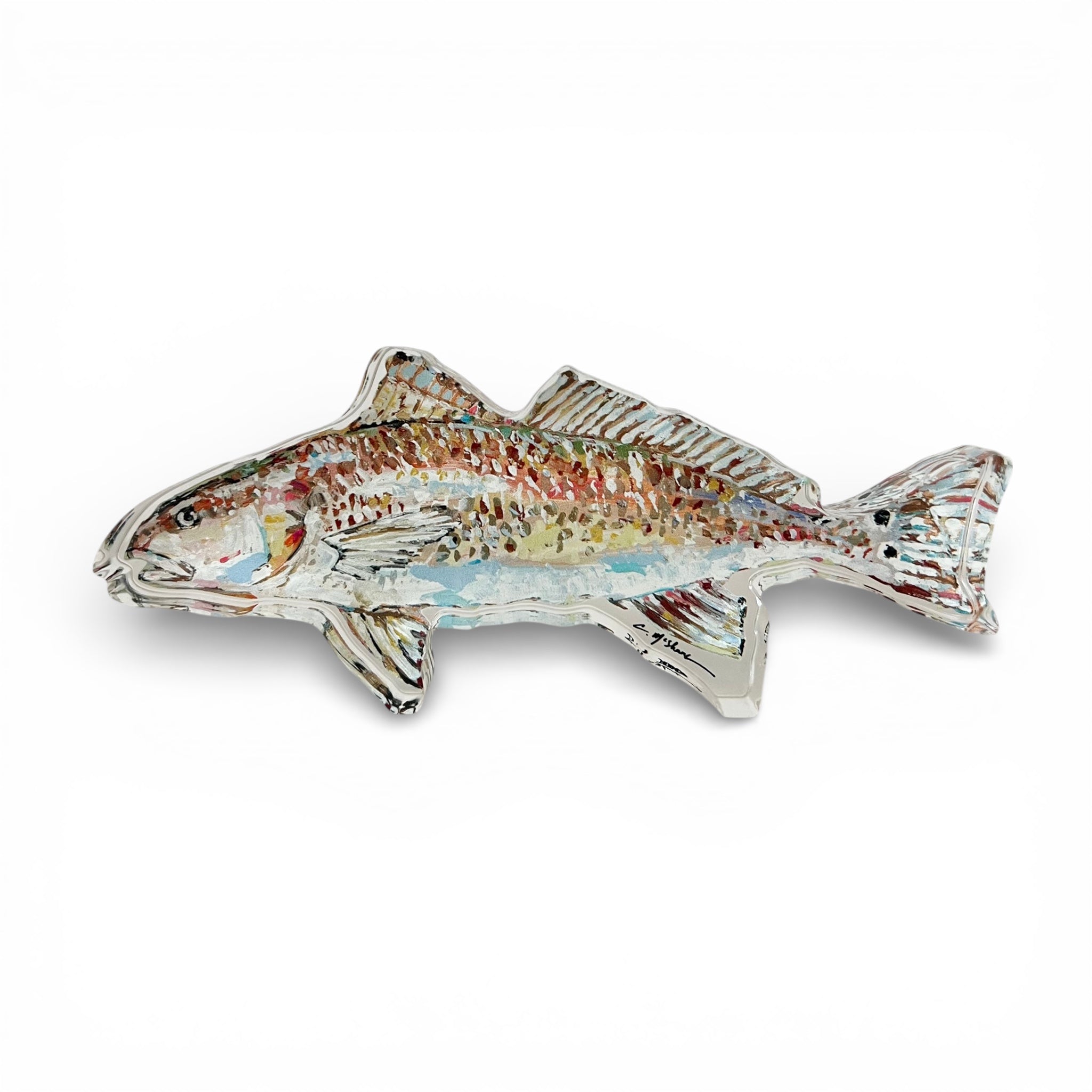 Redfish Acrylic Tabletop Art by Chelsea McShane on a shelf beside books and other decor