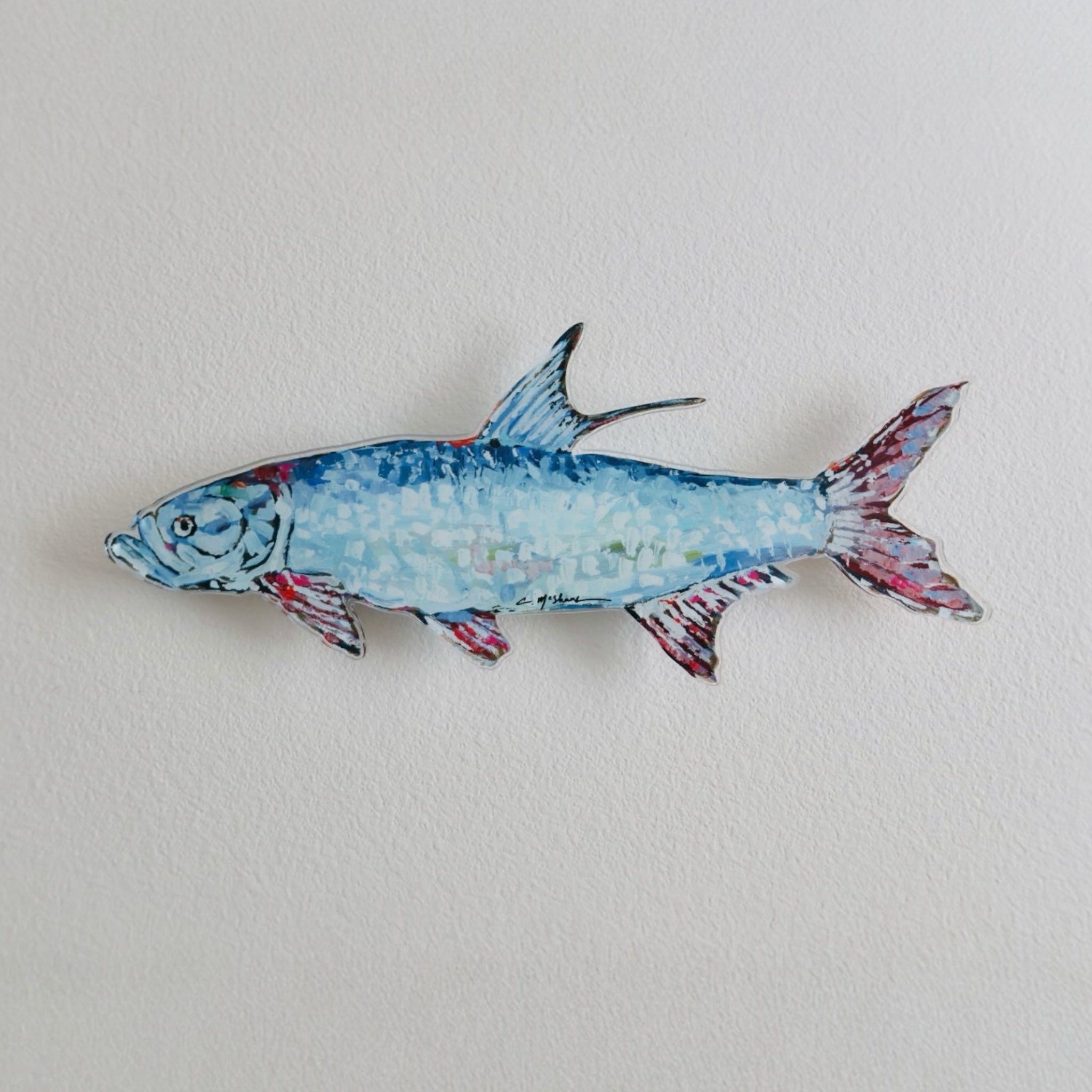 Colorful "Tarpon" shaped acrylic wall art featuring abstract white, black, and bright blue brush strokes on a yellow, orange, and red background.