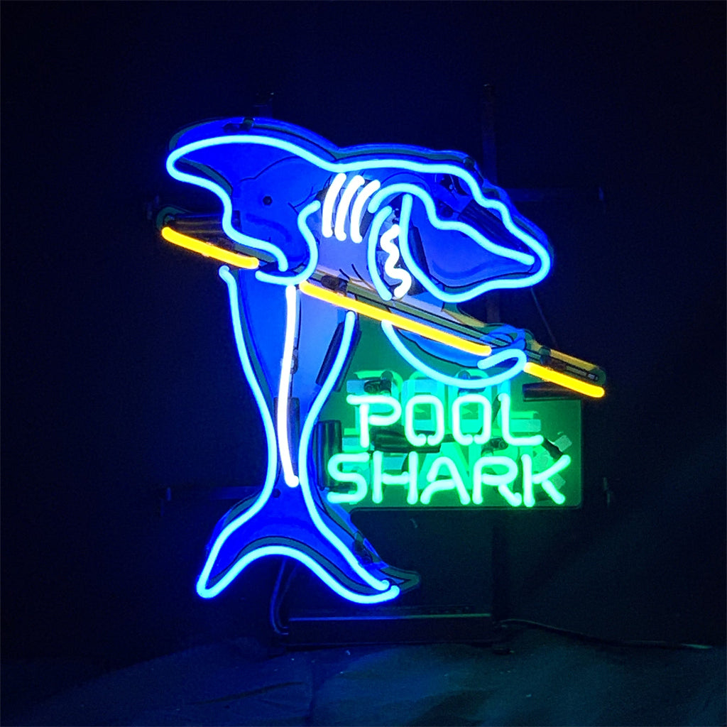 Pool Shark neon sign illuminated in a warm indoor setting