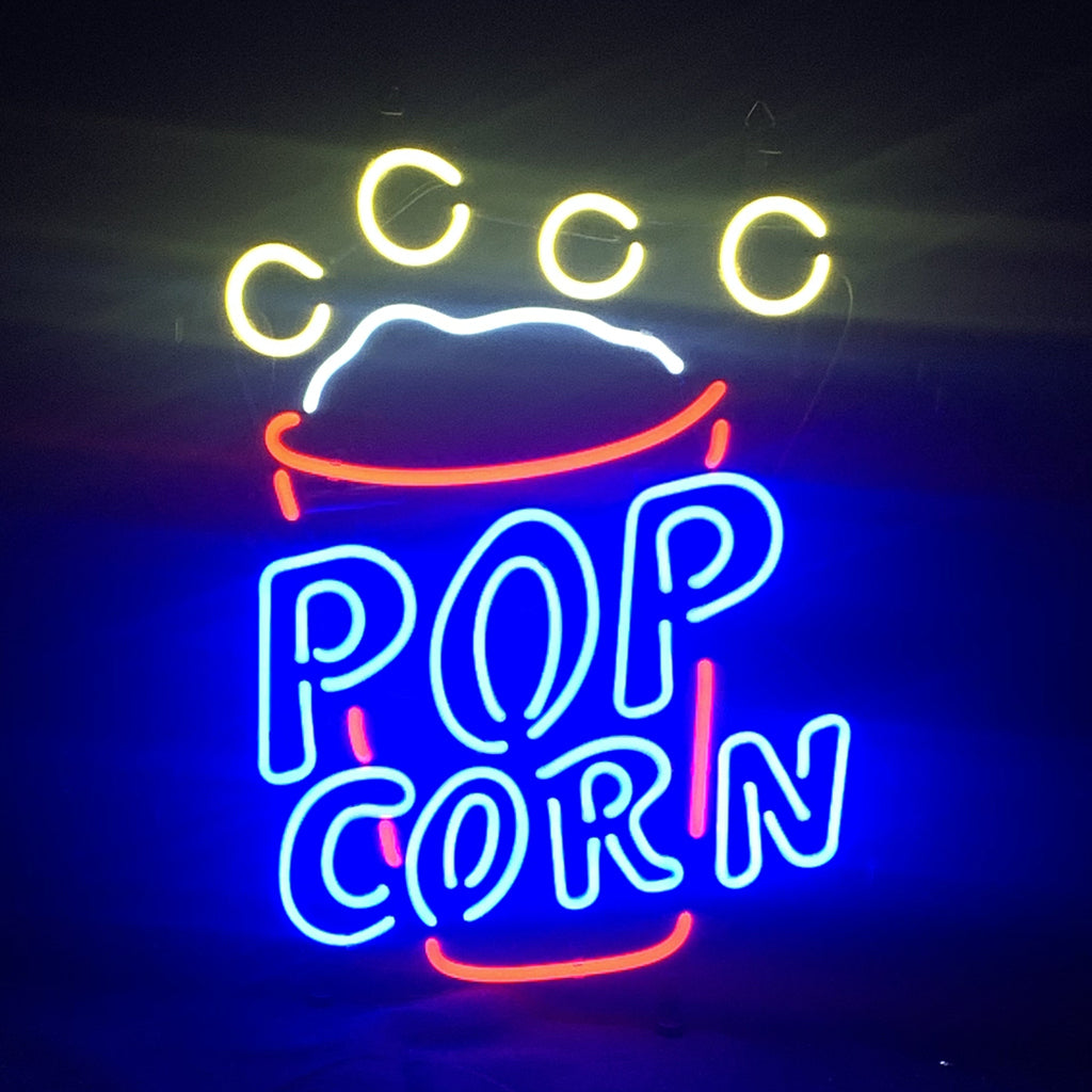 Popcorn Cup Neon Light Sign glowing in colorful neon tubes over a metal grid backing, hanging indoors