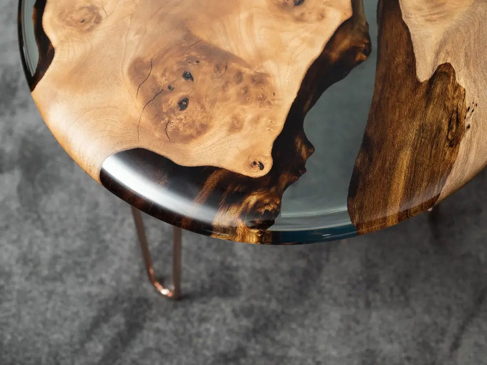 Round walnut wood side table with clear epoxy resin top and rounded edges from Osso Collection