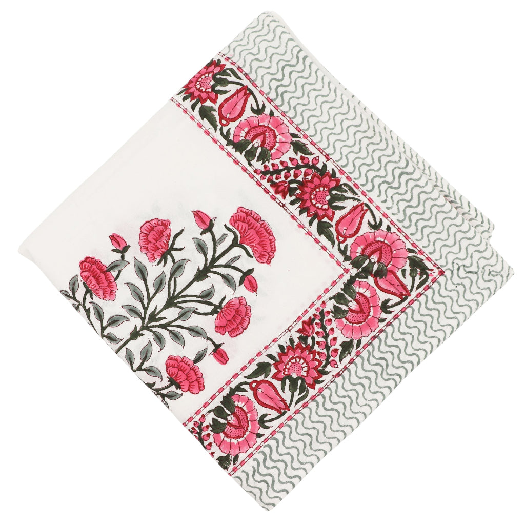 White Rose Garden Tablecloth with hand-painted pink roses and green fern patterns on a table