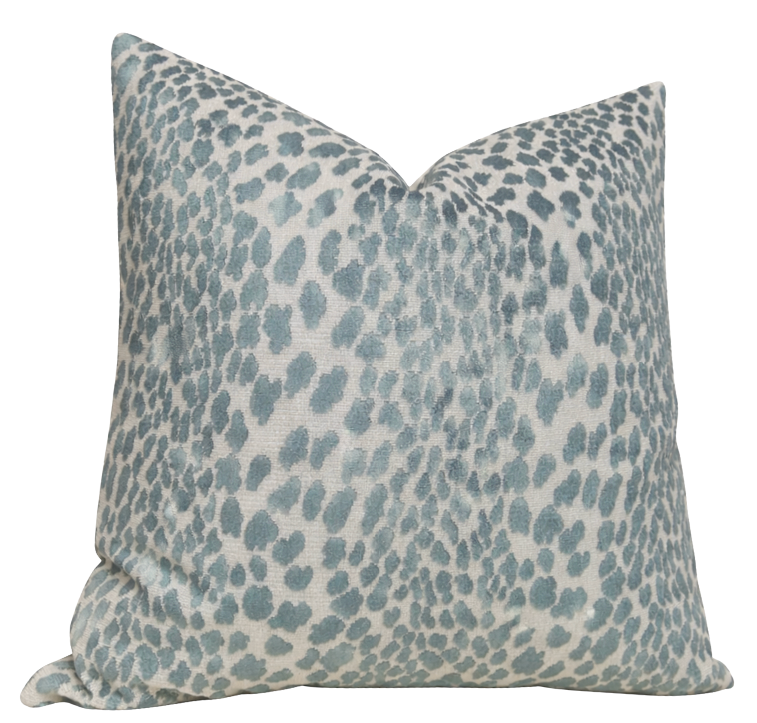Spotted Velvet Pillow Cover in marine velvet front with ivory linen back, displayed on sofa
