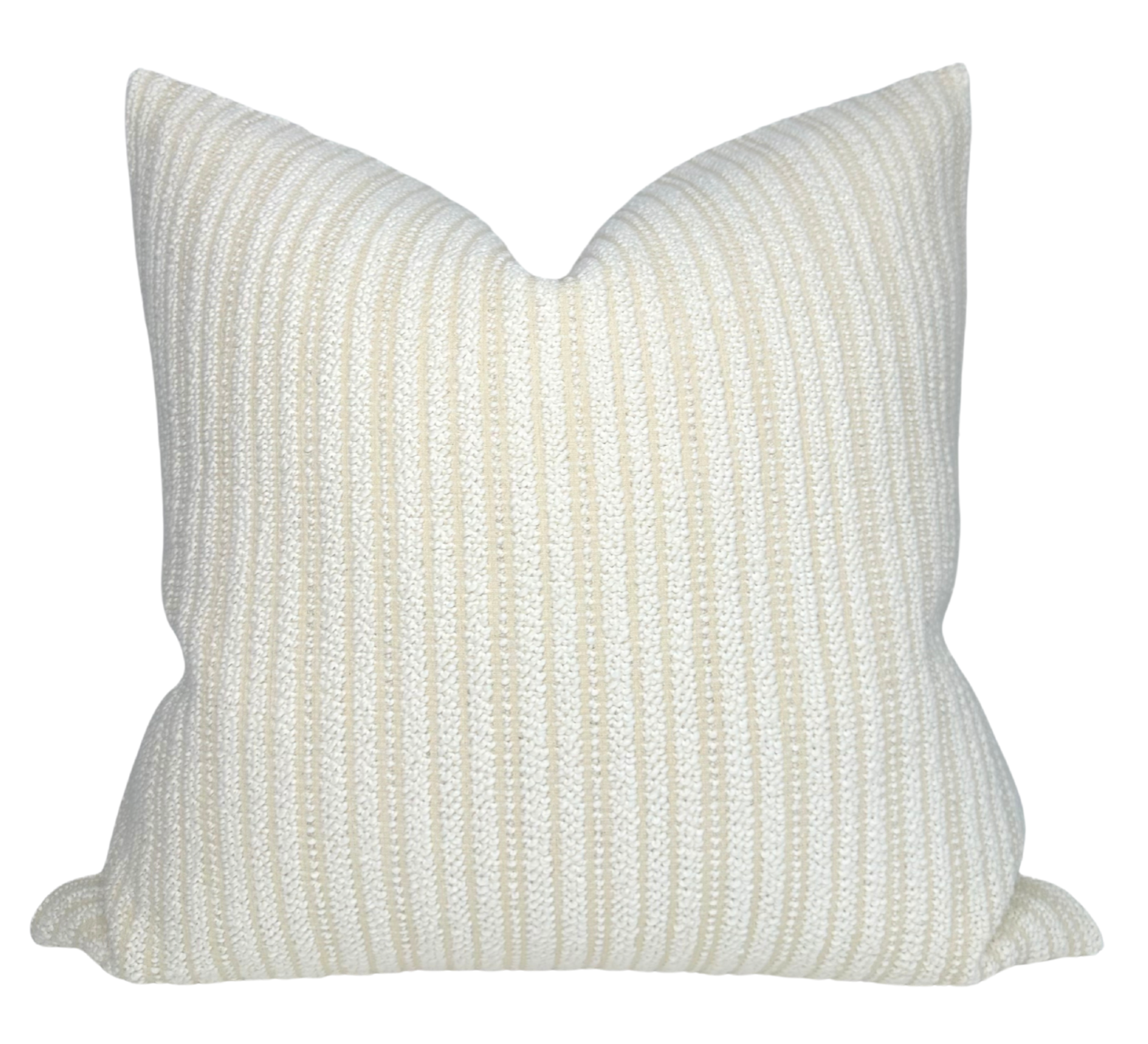 Divide Woven Pillow Cover in Ecru laying on a sofa with complementary neutral decor