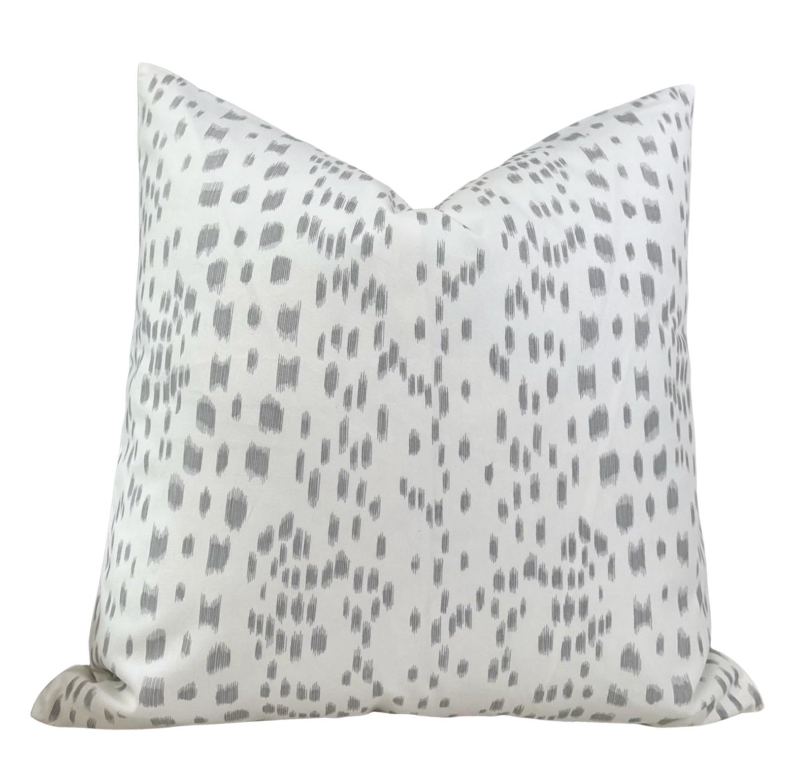 Les Touches Pillow Cover in Gray styled on a sofa