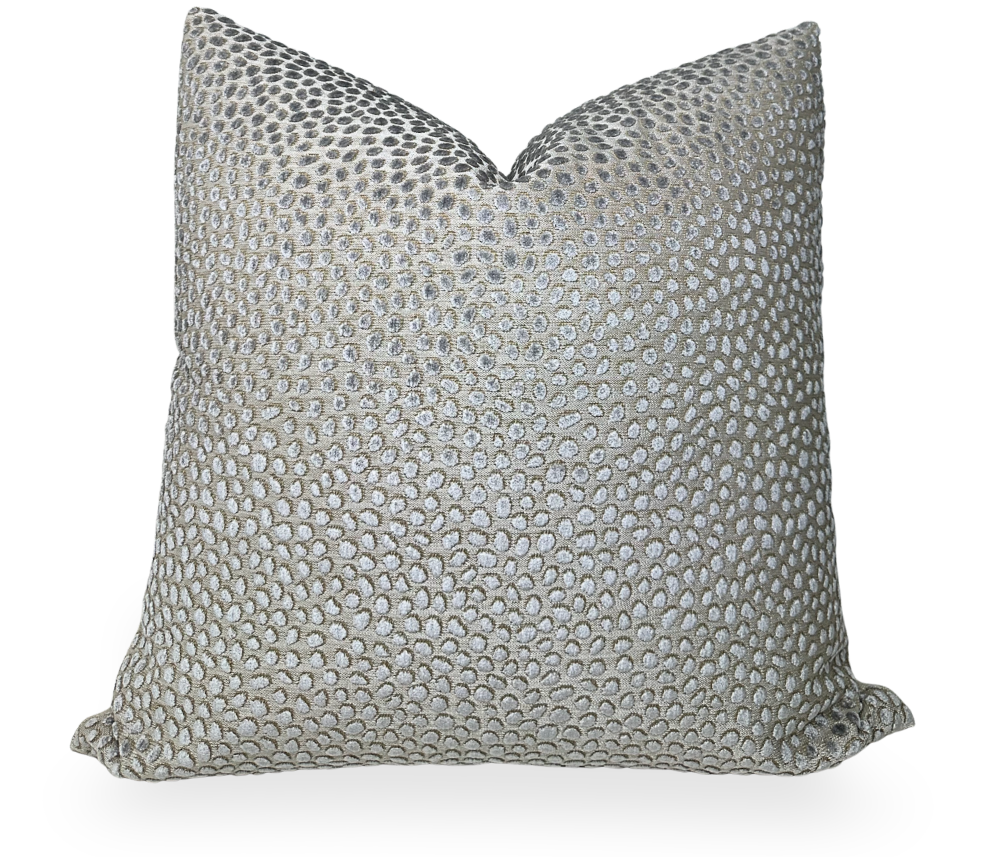 Grey velvet pillow cover with beige linen back folded on a chair