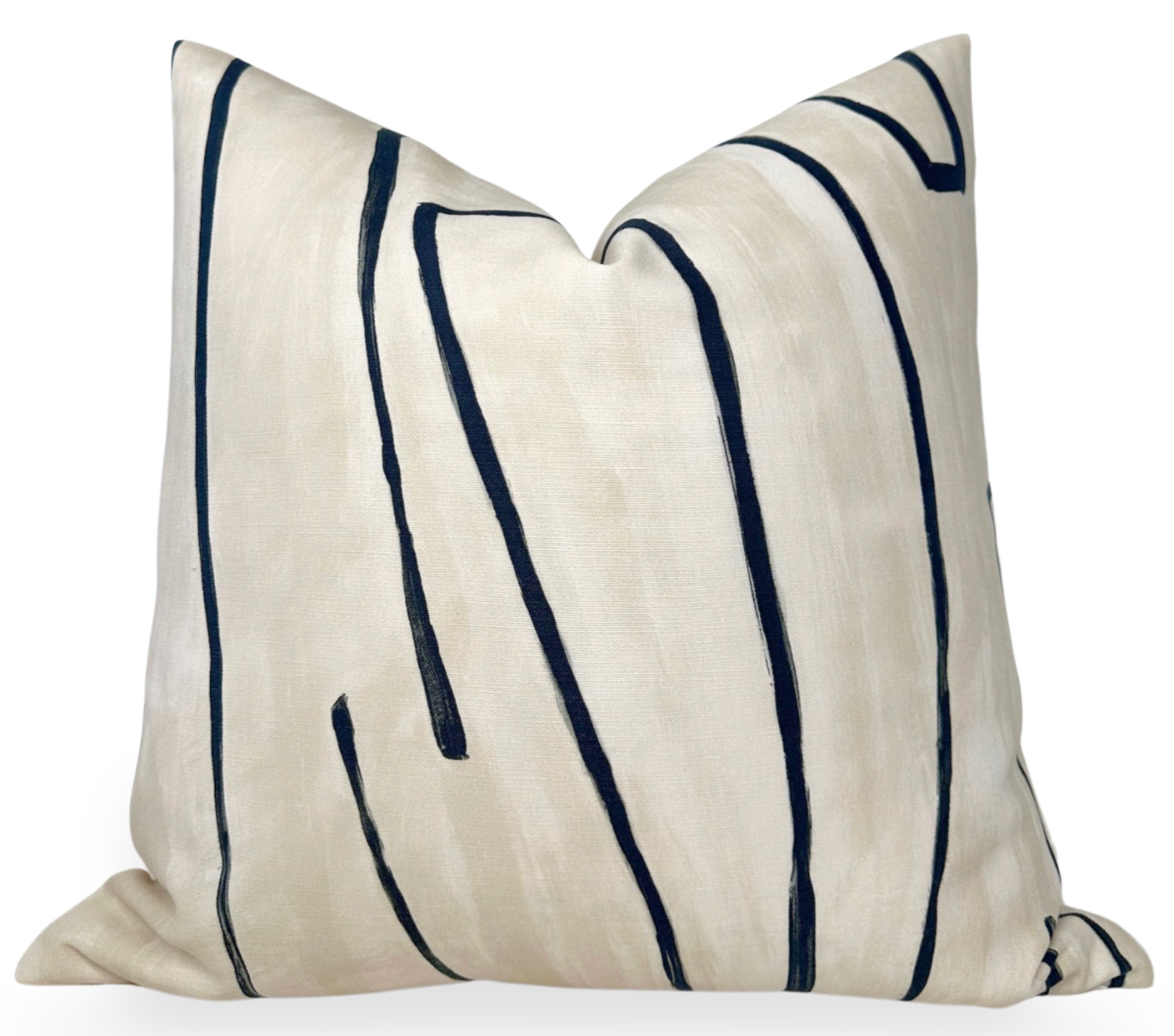 Graffito Pillow Cover in Ivory Linen Onyx photographed with abstract patterns on linen fabric