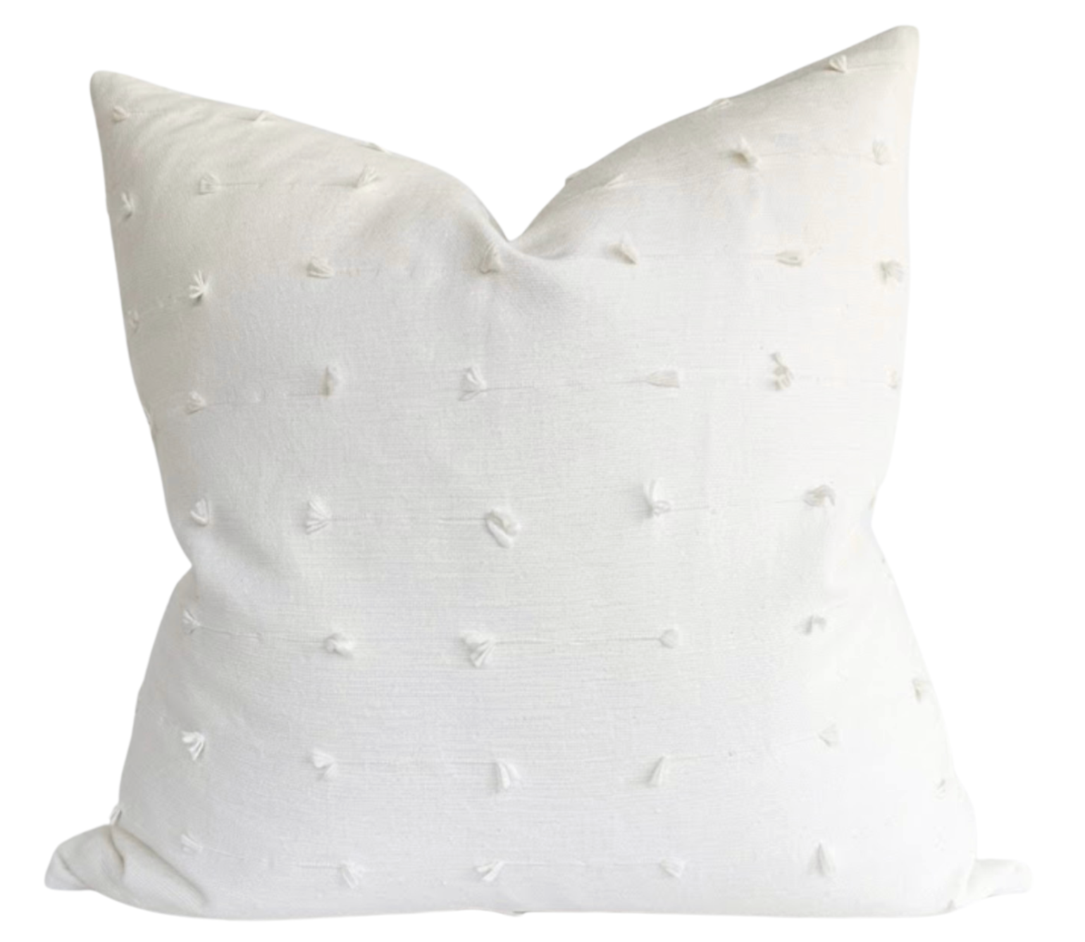 Teton Embroidered Pillow Cover in Snow displayed on a sofa showing embroidered front with ivory linen back