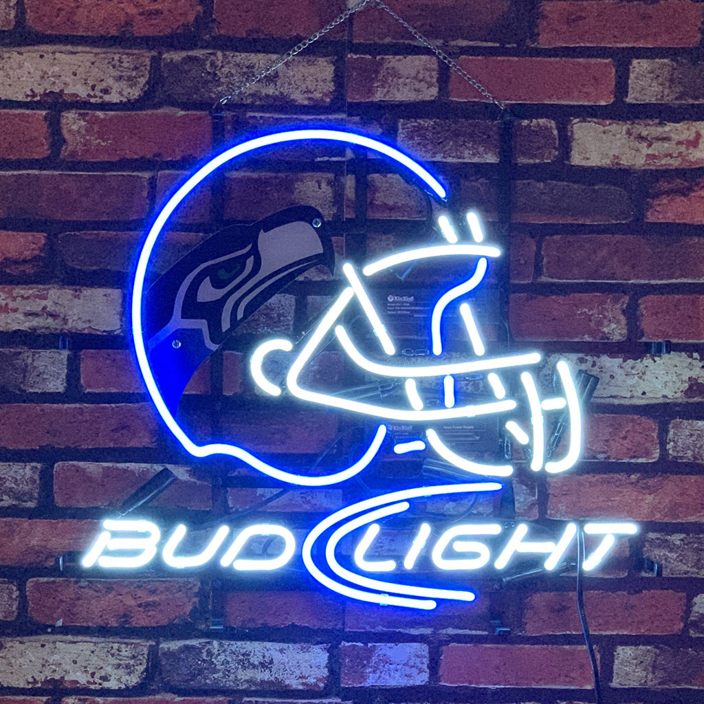 Seattle Seahawks Helmet Bud Light Neon Sign glowing indoors
