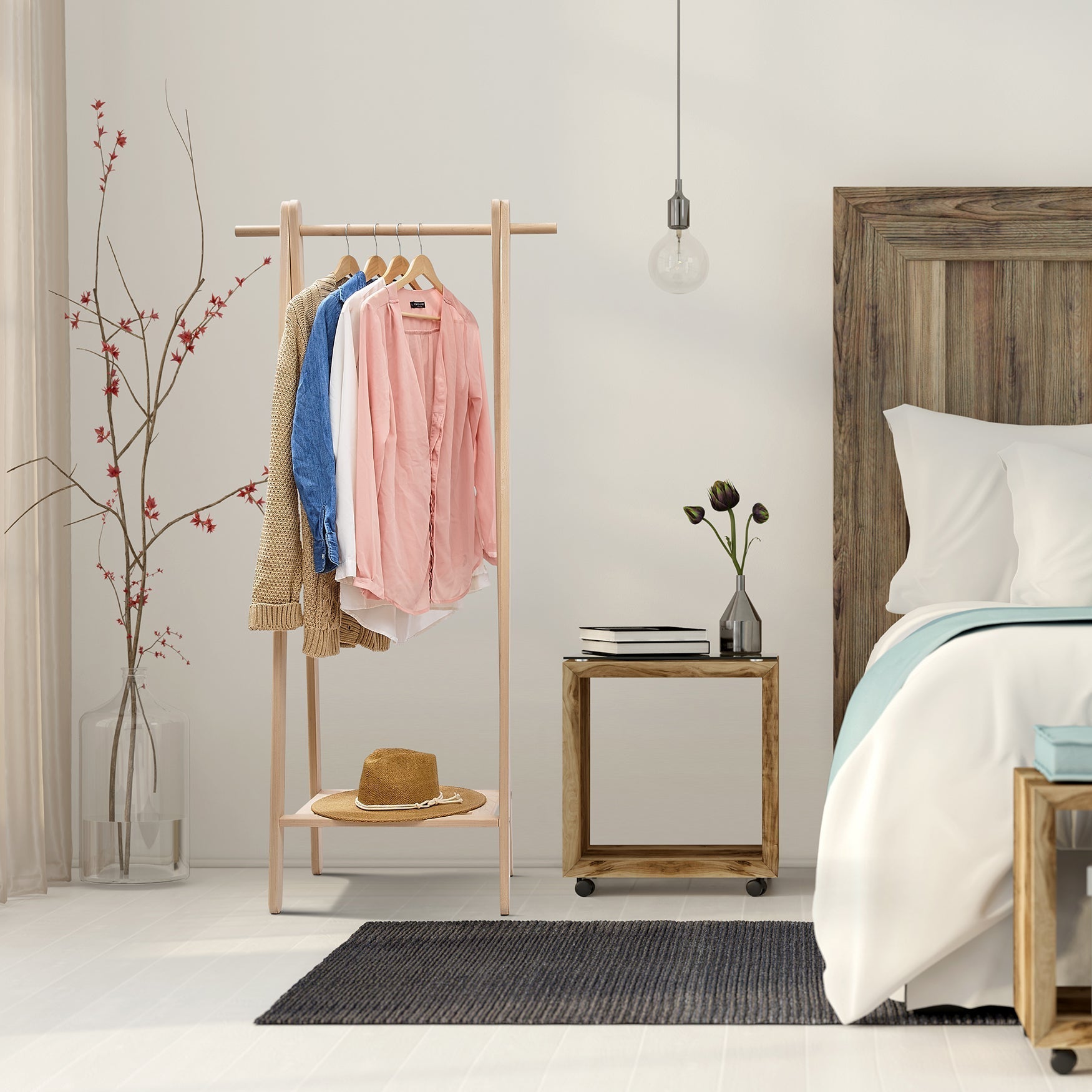 Handcrafted wooden garment rack holding clothes and coats in a home setting