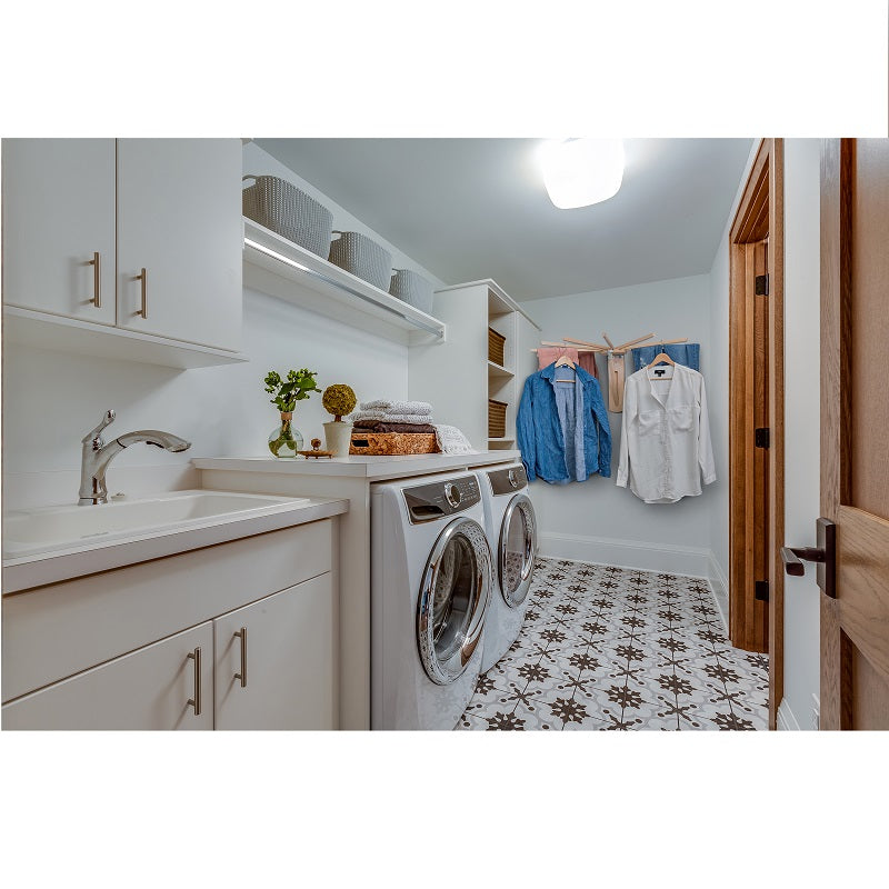Fold down wall mounted clothes drying rack made of maple hardwood with clothes drying on it