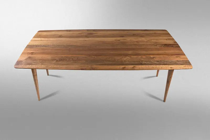 Edge glued solid hardwood dining table with natural wood grain and smooth surface